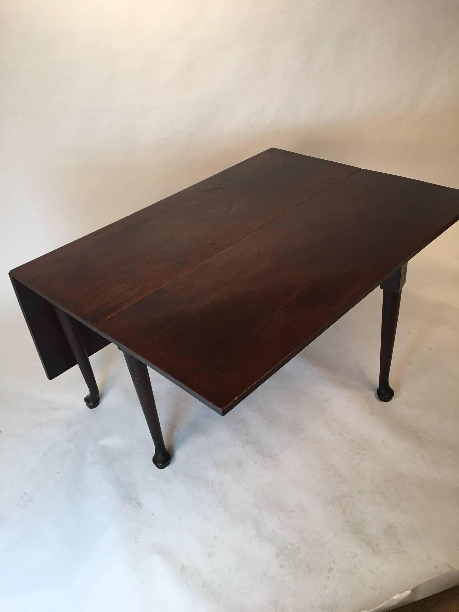 Versatile drop-leaf table in beautiful Honduran mahogany.