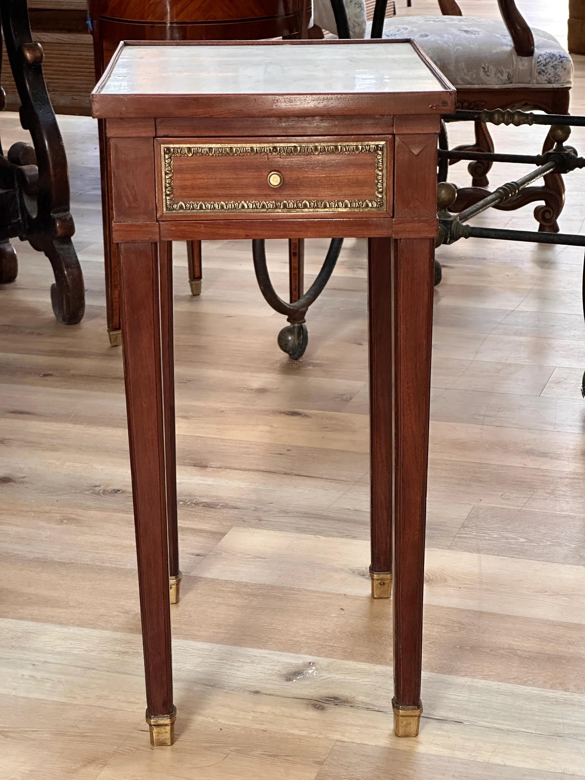 Rare and elegant petite 18th Century Mahogany Side Table, Louis XV period, by famous ebeniste Jean-François Leleu (1729-1807), stamped, the rectangular marble top over a case having a single drawer supported by four square tapered legs, having fine