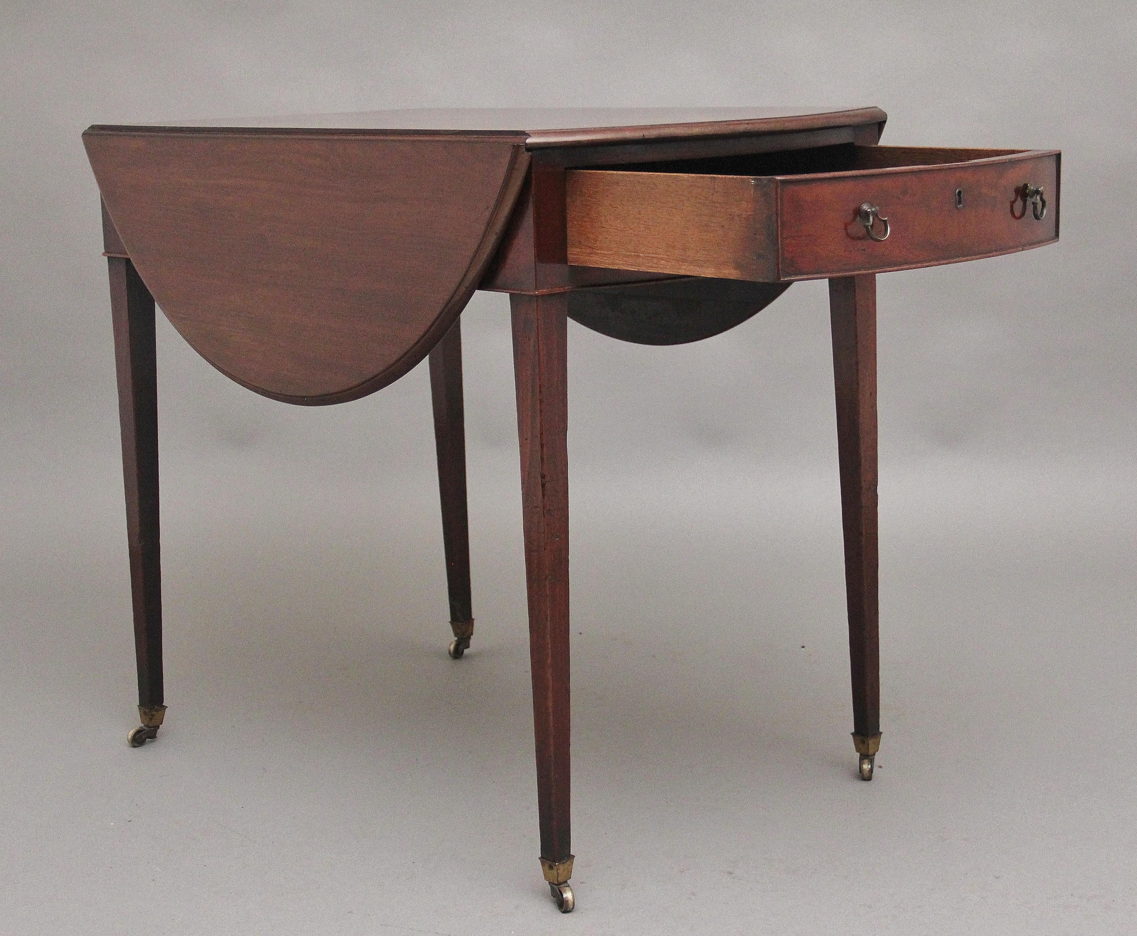 A fabulous quality early 18th Century mahogany oval Pembroke table, having a wonderful solid figured top with a moulded edge, single oak lined drawer at one end with brass ring handles, the other end having a faux drawer, supported on square