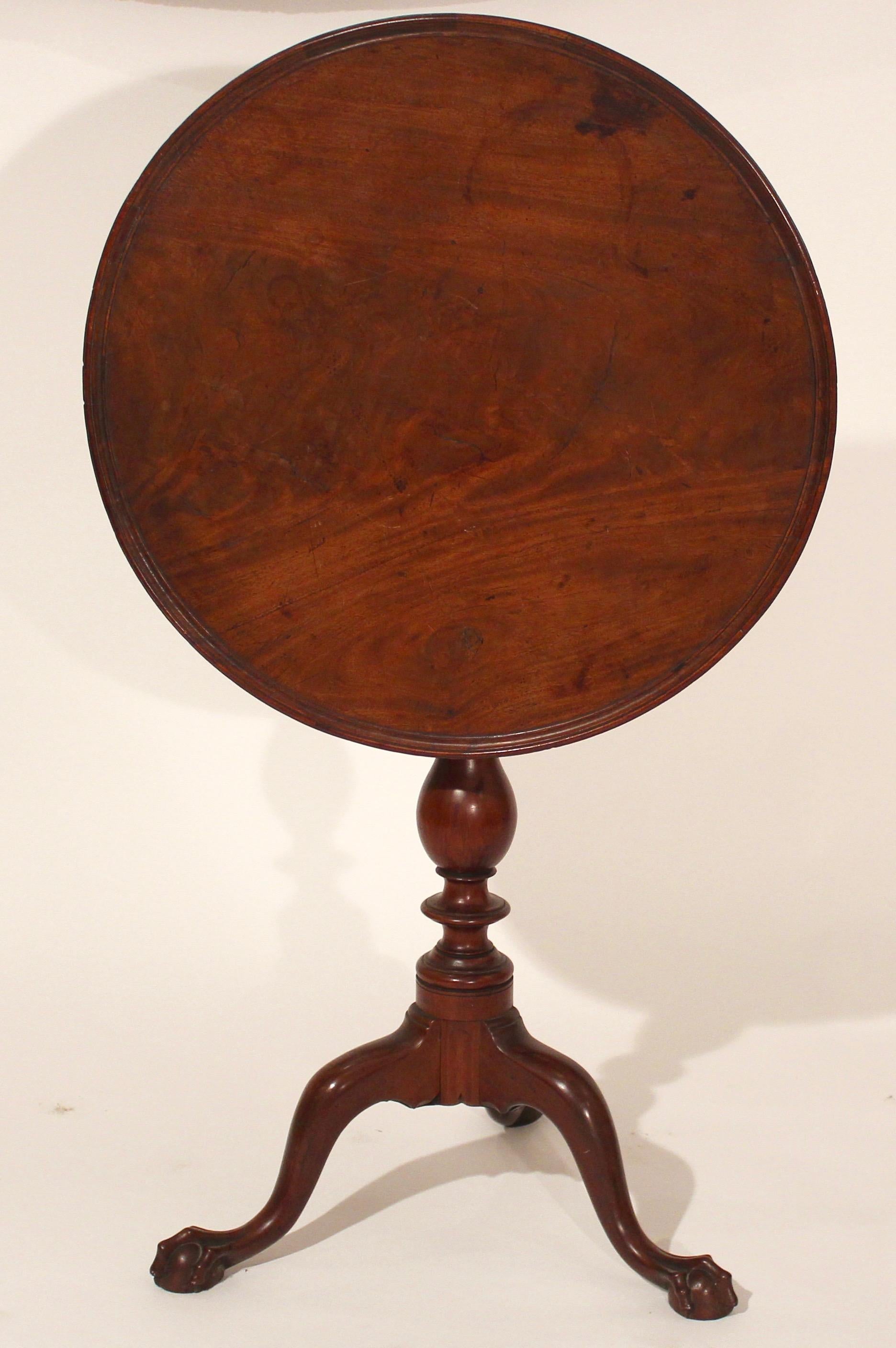 18th century mahogany Philadelphia Chippendale rare claw and ball foot candle stand with a vase pedestal cabriole legs terminating in claw and ball feet.