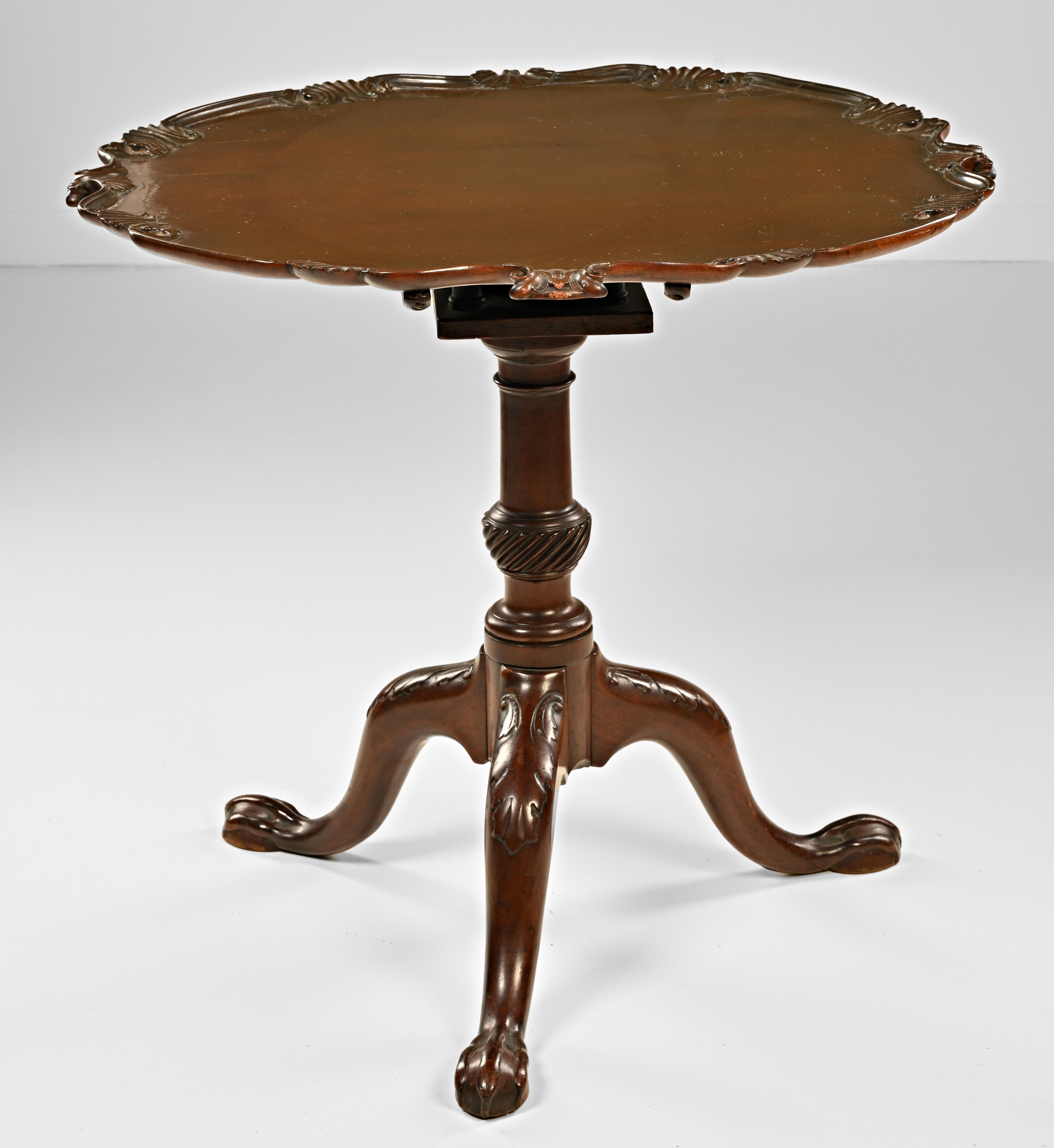 A rare and fine example of an 18th century bird cage pie crust tea table. This piece was deaccessioned from the San Diego Museum of Art and retains its label and inventory numbers. They had this table listed as American and from Newport. It is
