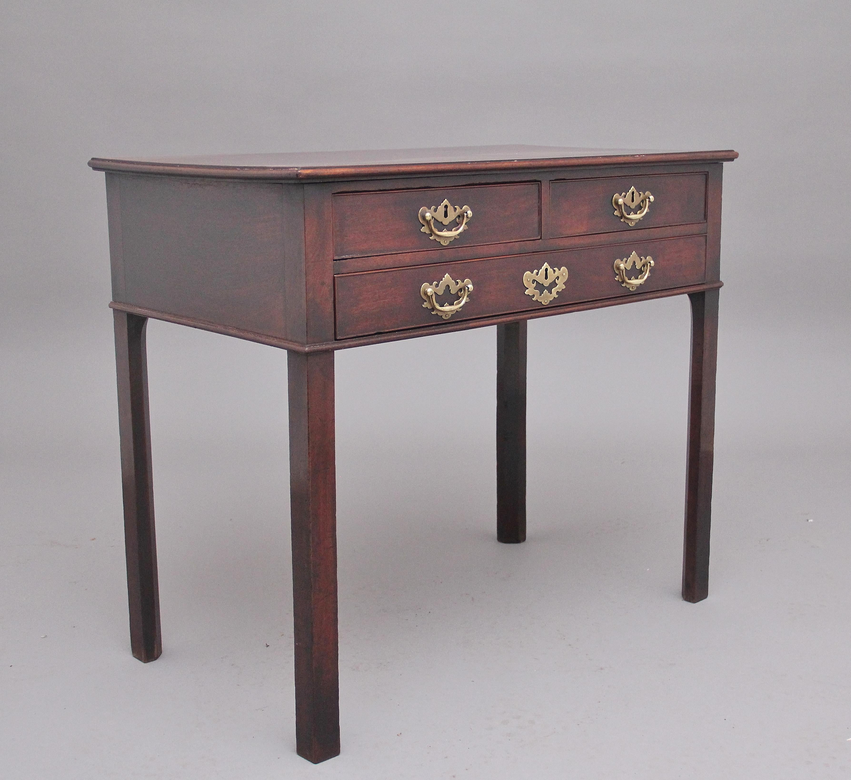 18th Century mahogany side table, having a lovely figured top with a moulded edge above three oak lined drawers with the original brass plate handles and escutcheon, supported on square legs. Circa 1780.
 