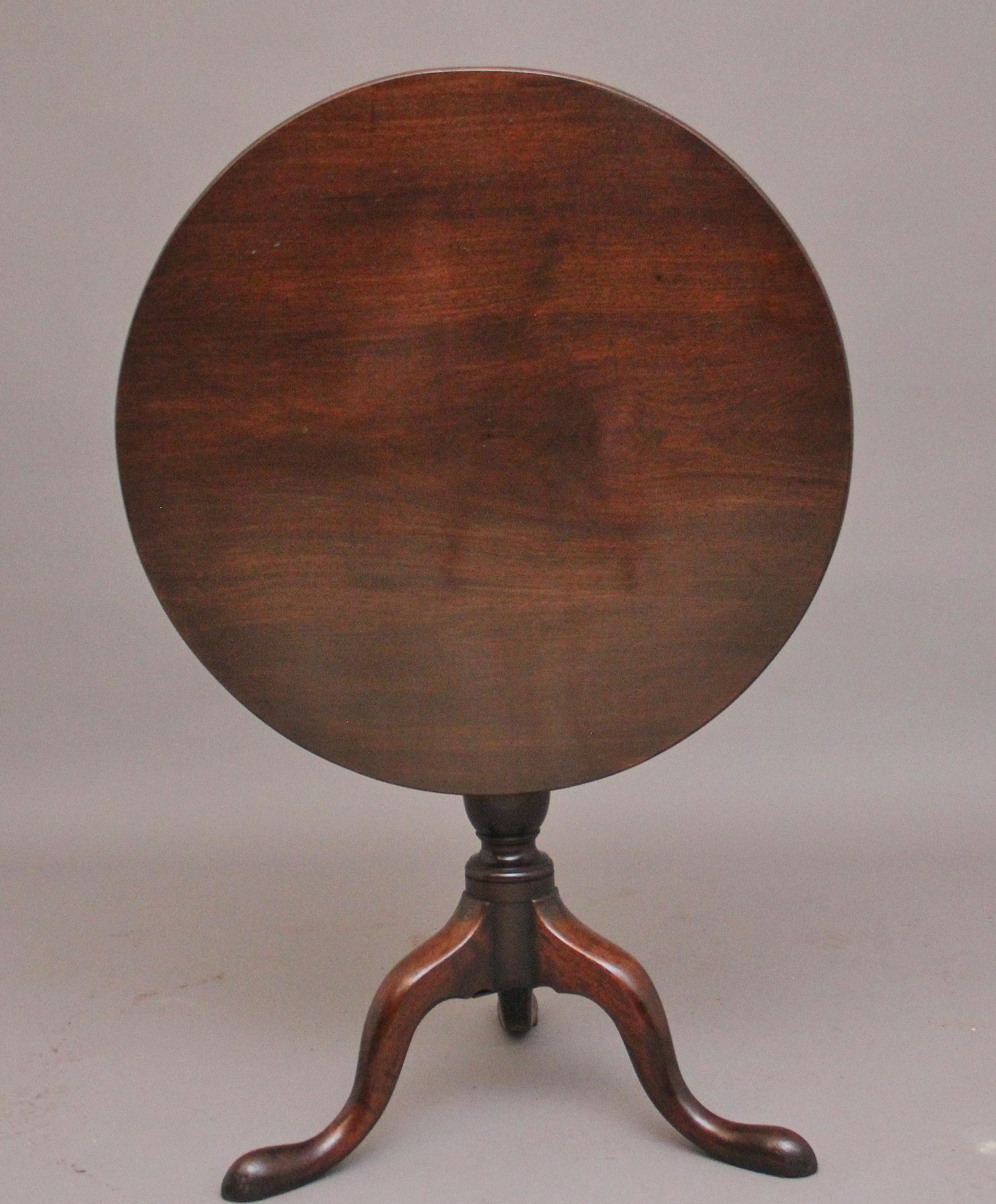 18th Century mahogany tripod table, having a lovely figured circular top, supported on wonderfully turned column terminating with three slender shaped legs, in fantastic condition and having a nice warm mahogany colour.  Circa 1770.