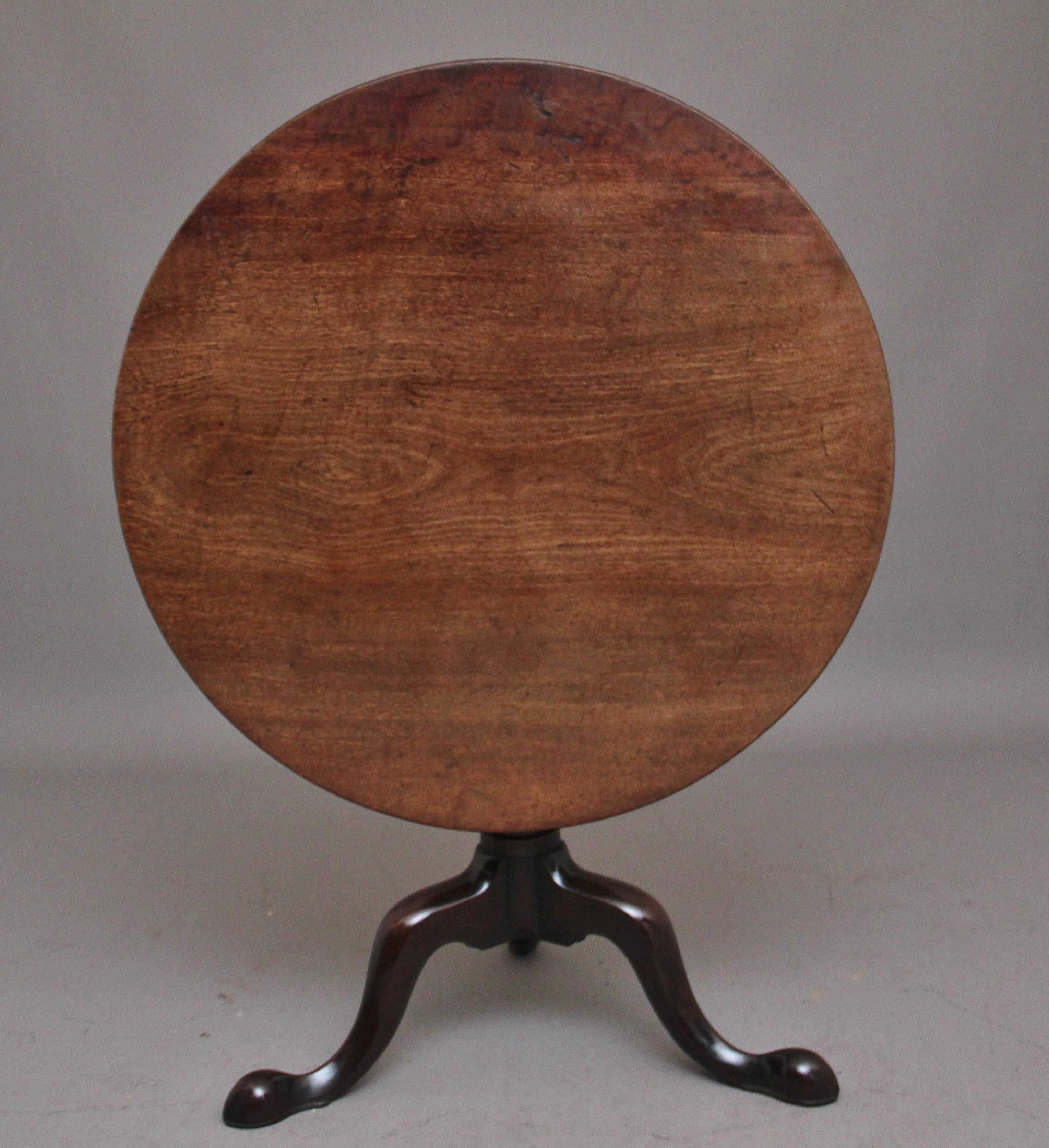 A superb 18th century mahogany tripod table, having a wonderful figured circular top supported on a carved turned column terminating with three slender shaped legs. Lovely color and in excellent condition. Circa 1780.