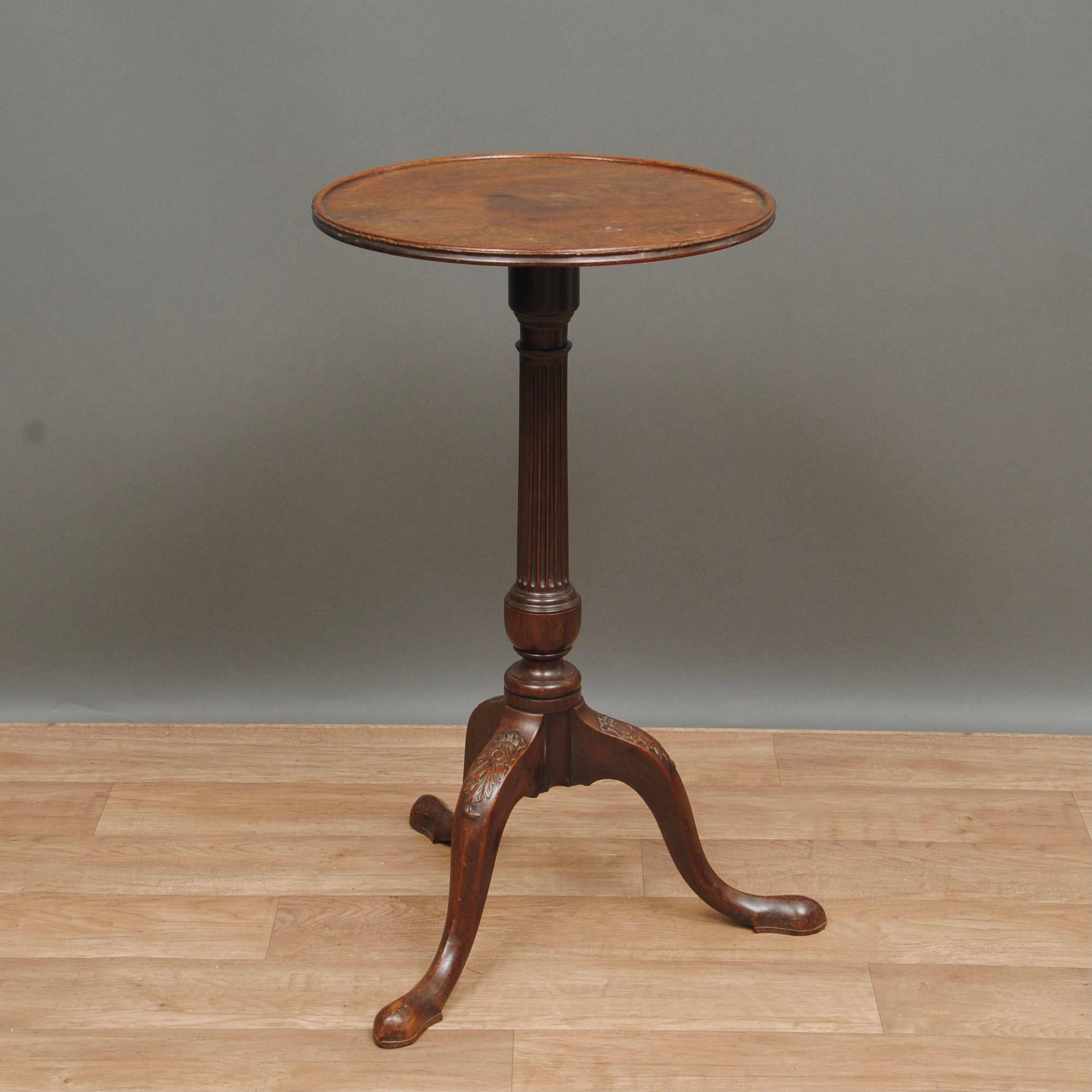 An elegant 18th century mahogany tripod or wine table with reeded column and carved cabriole legs, good color and patina.