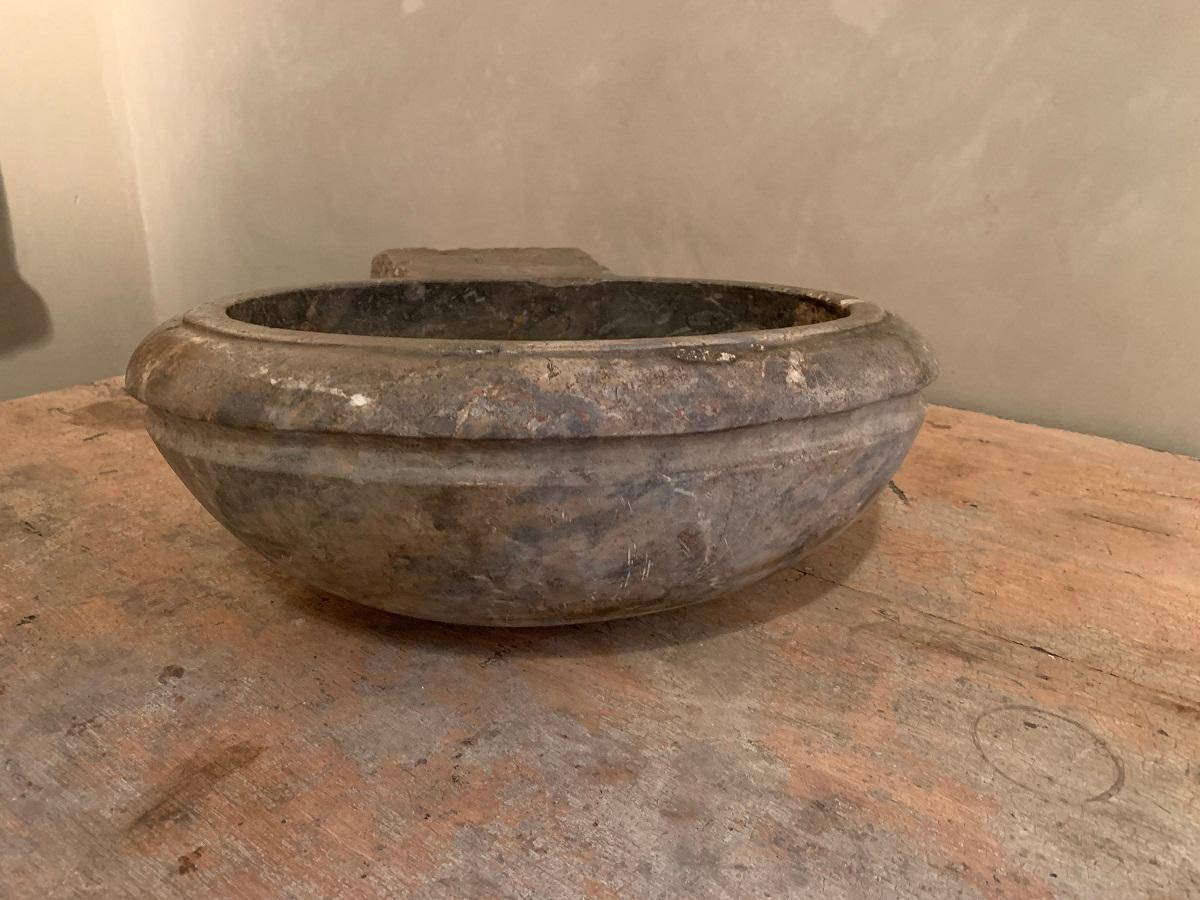 A small 18th century French basin, so called 'benitier'. These were originally used in churches and chapells to contain holy water. Now they make a perfect basin for powder rooms.