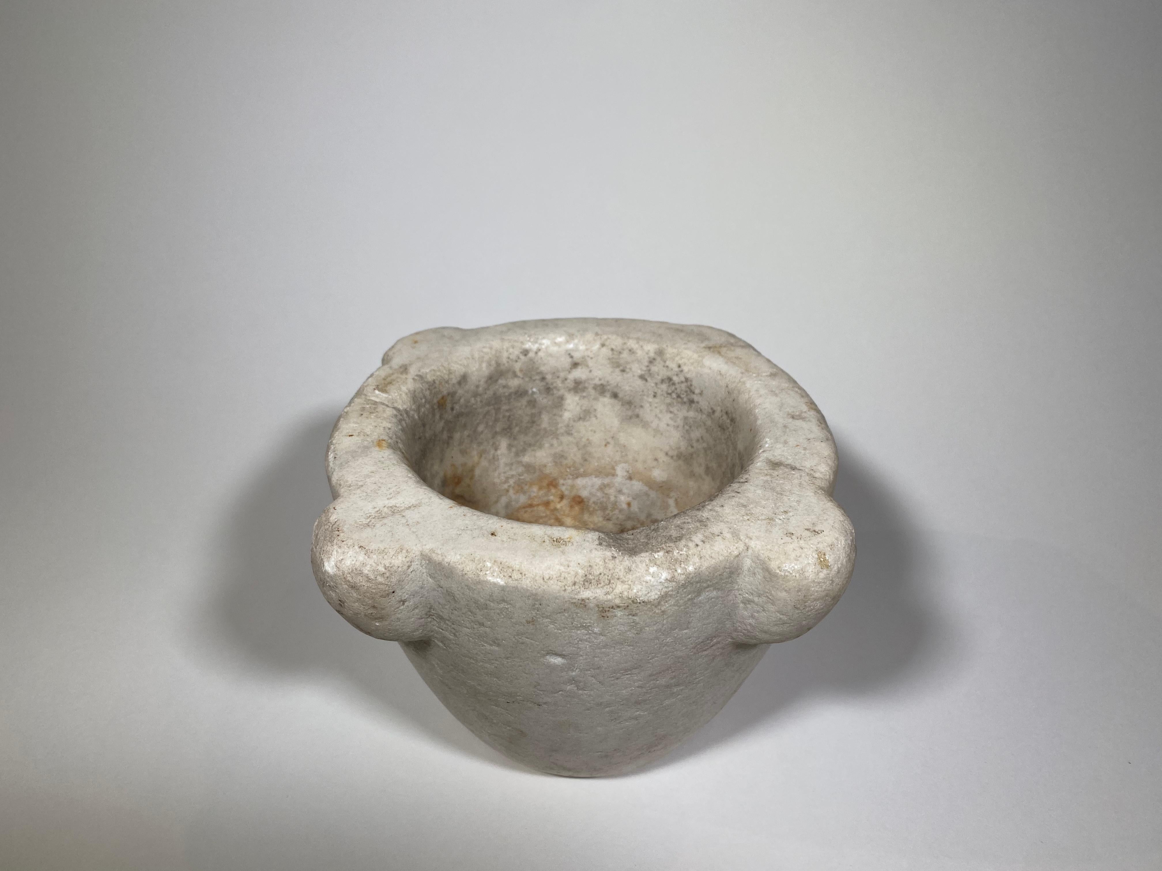 A very charming 18th century mortar from the Catalan region in Spain. Beautifully carved from marble. A wonderful accessory piece for any kitchen, bathroom, or table top.