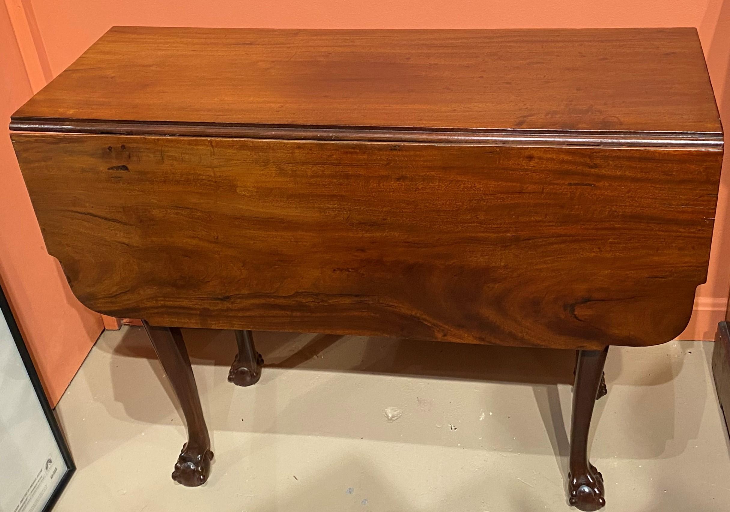 A fine form mahogany rectangular drop leaf table with chestnut & pine secondary woods, astragal corners on the table top, swing out cabriole legs on each side, terminating with nicely carved ball and claw feet. Massachusetts in origin, dating to the