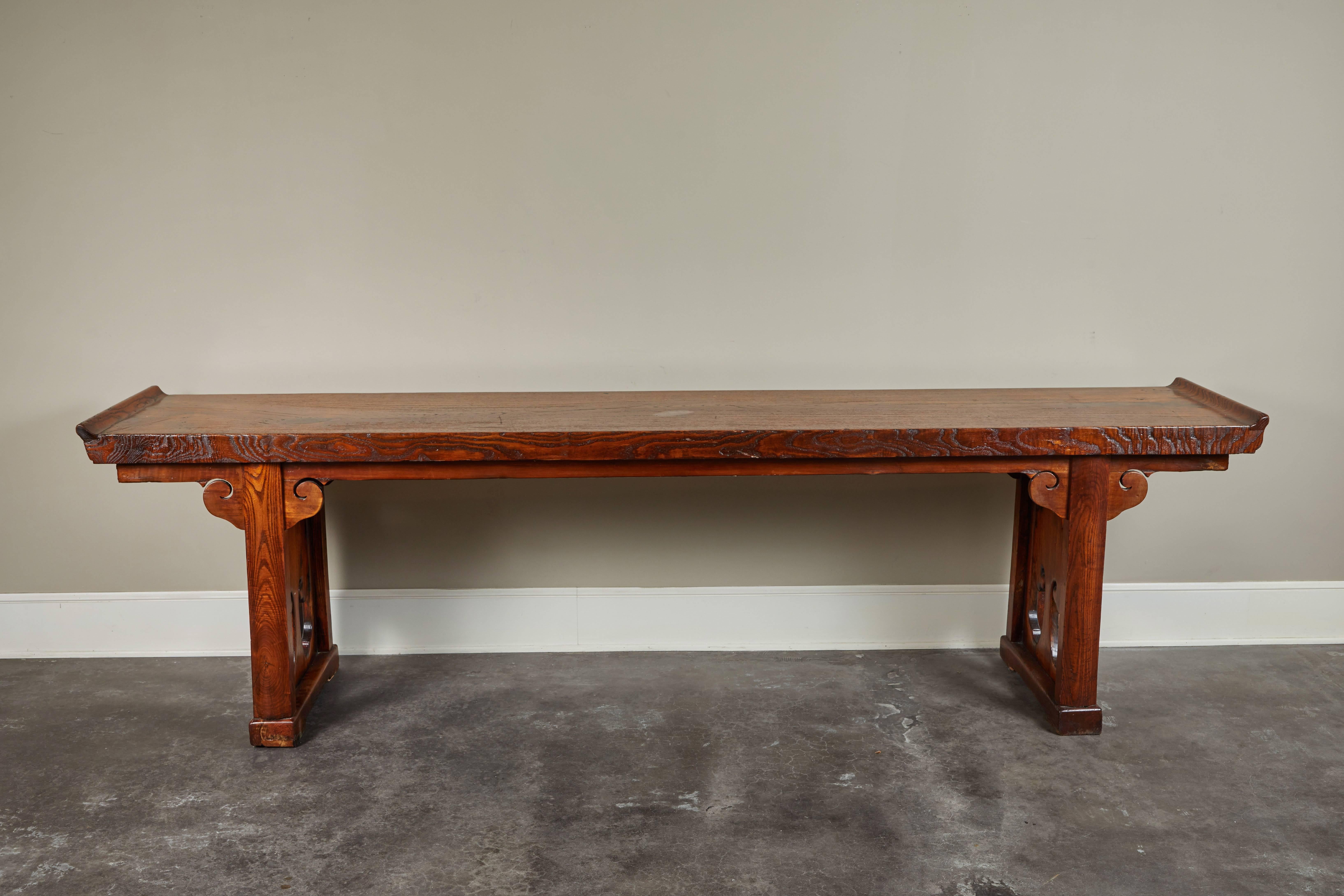 A Ming period single piece elm top scroll end altar table. Originally from Shanxi, China.
