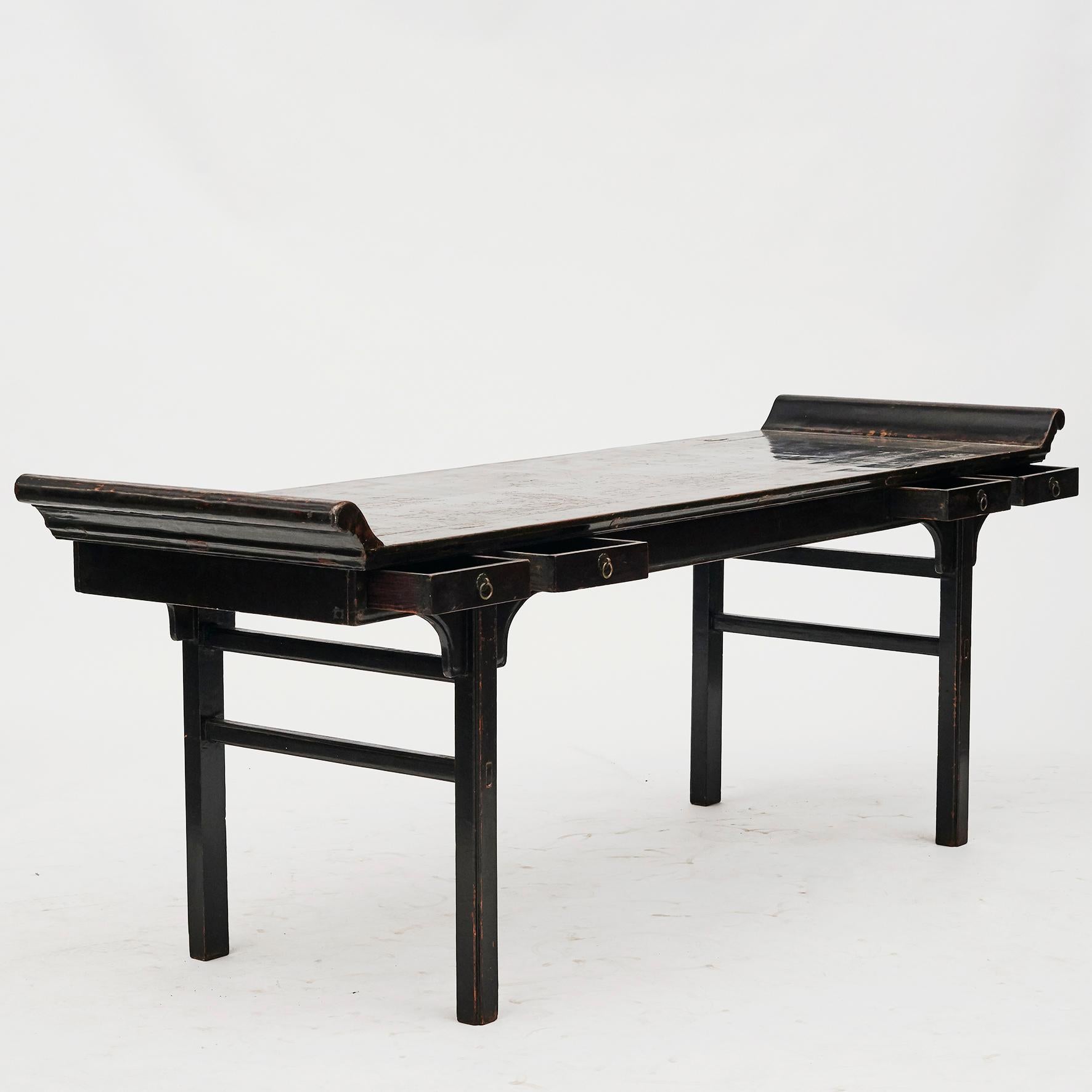 Large Chinese alter table / calligraphy table. Beijing mid-18th century.
Original black lacquer. Table top thick lacquer with natural patina. Walnut with a beautiful age-related patina.
Four drawers at the front.
Has presumably been altar table