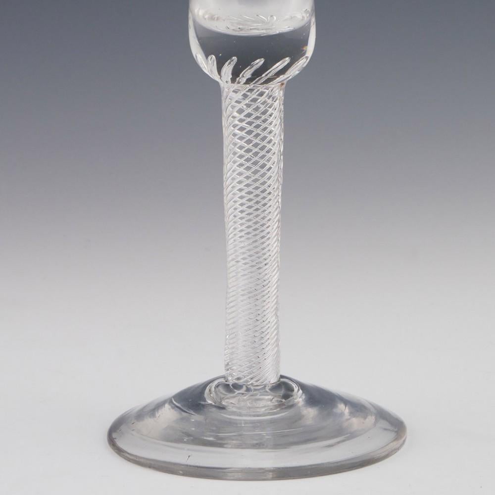 Heading : Air twist stem Georgian wine glass
Period : George II - c1750
Origin : England
Colour : Clear
Bowl : Bell
Stem :Multi spiral air twist
Foot : Conical
Pontil : Snapped
Glass Type : Lead
Size :  16.4cm height, 6.6cm diameter bowl, 7.3cm