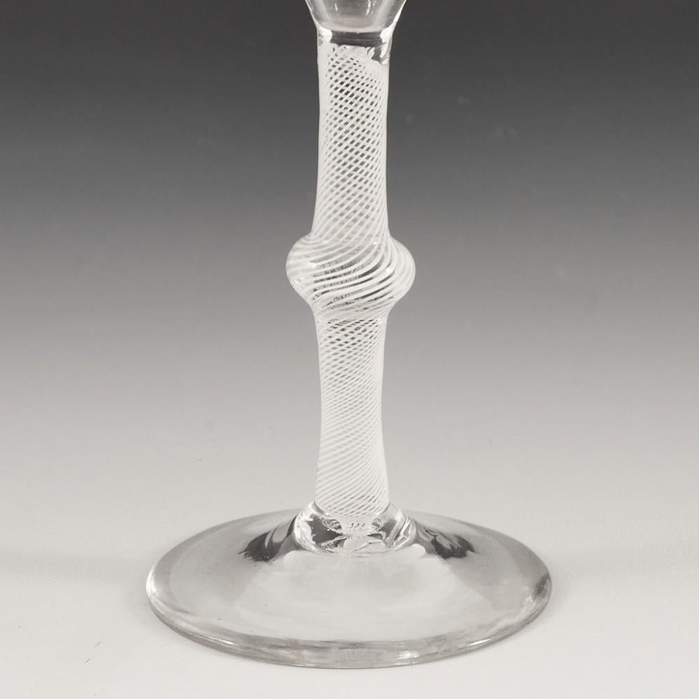 Heading : 18th Century Multi Spiral Opaque Twist Wine Glass c1760
Period : George II- George III
Origin : England
Colour : Clear
Bowl : Ogee
Stem : Multi spiral opaque with medial swelling knop
Foot : Conical
Pontil : Snapped
Glass Type : Lead
Size