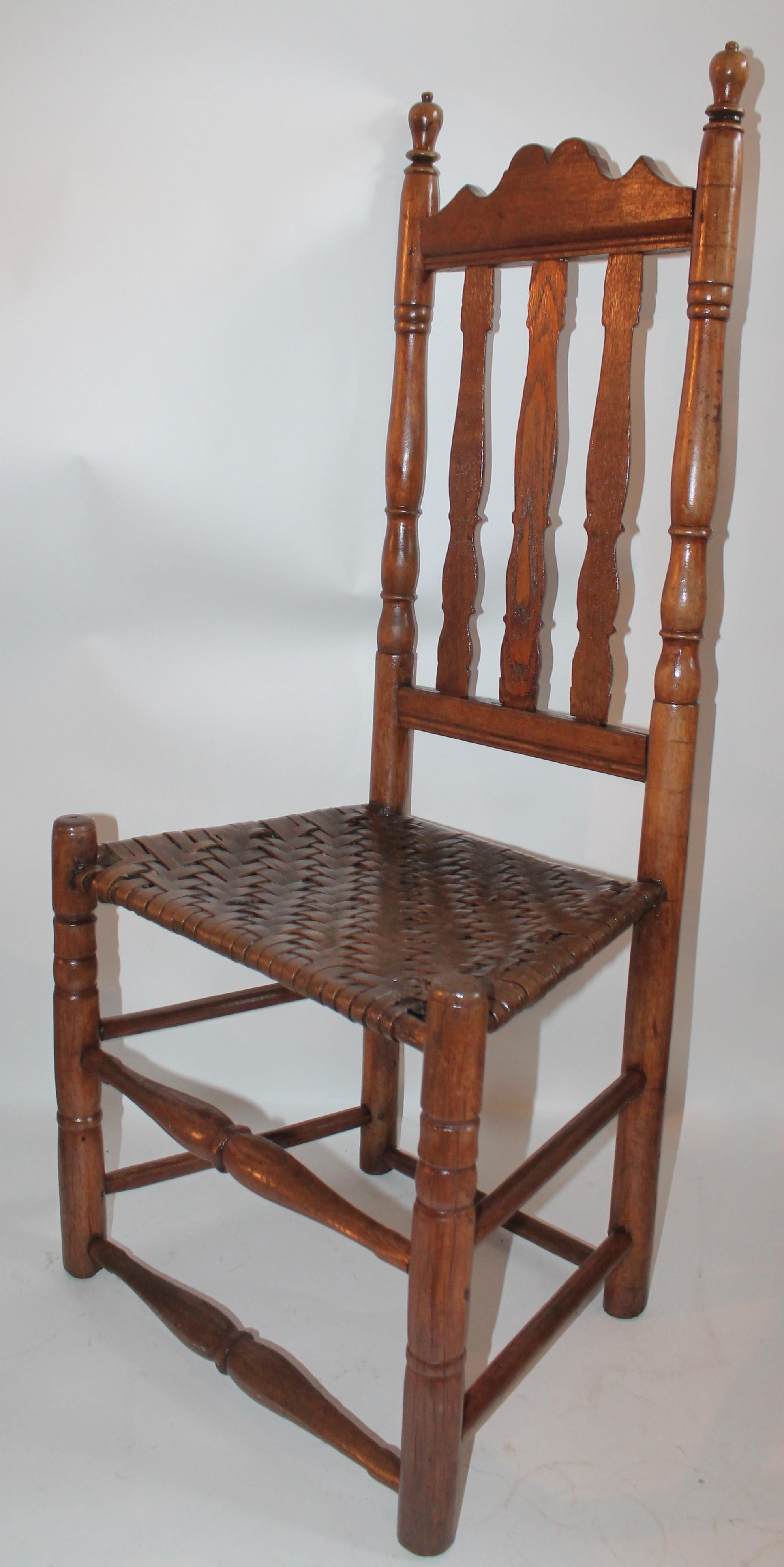 This fine all original 18th century banister back chair is from New England and is in fine condition. The hand woven seat is all original.