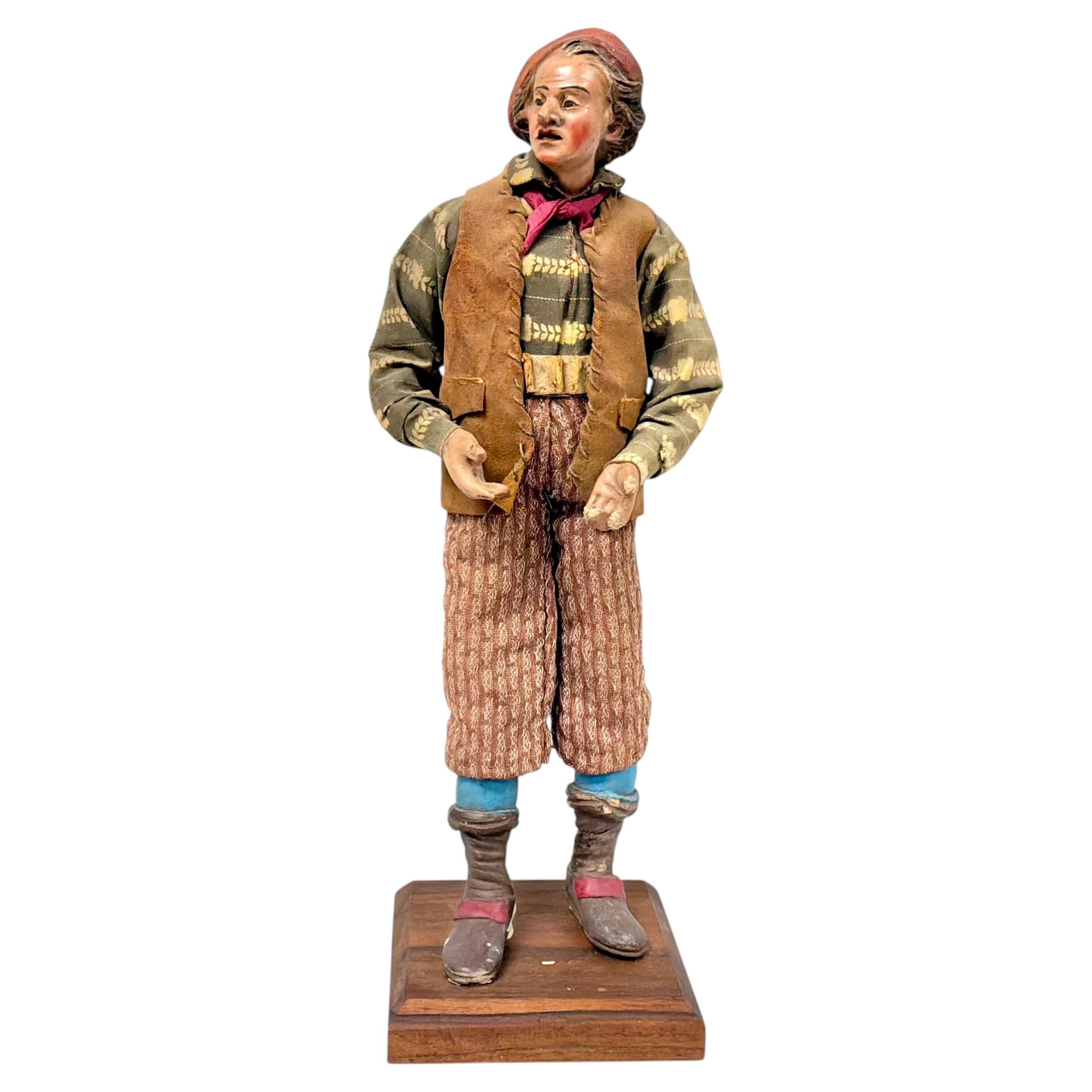 Figura da presepe napoletana del XVIII secolo, uomo in terracotta e legno con berretto rosso