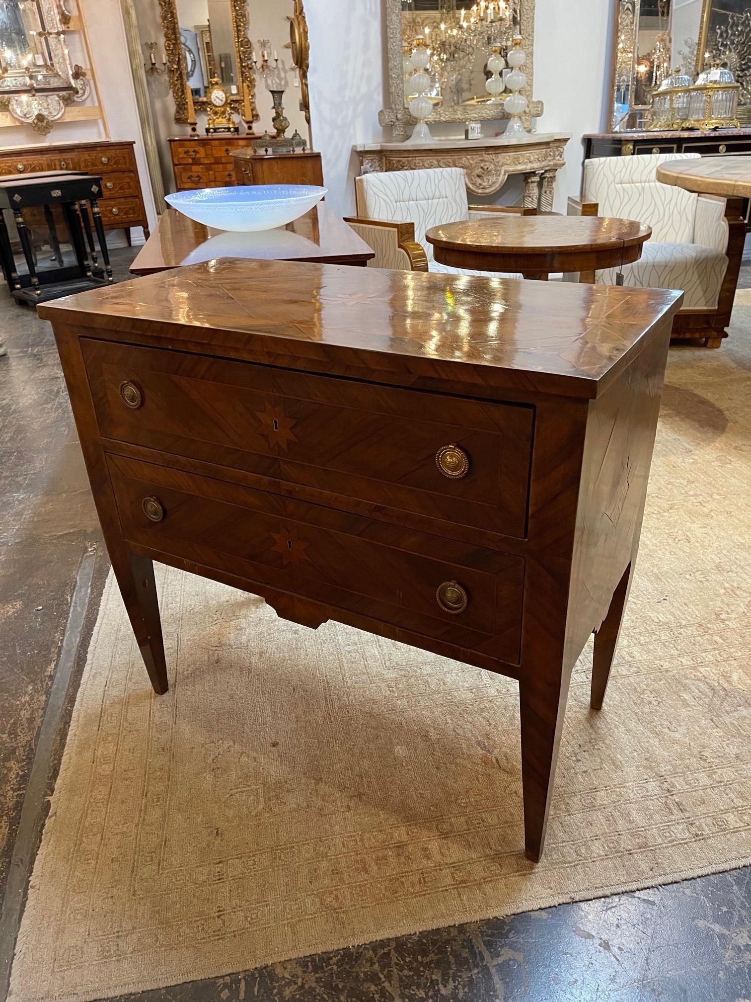 Gorgeous 18th century neoclassical walnut 2-drawer chest. Beautiful inlaid wood including a star shape. The finish is amazing as well. A beautiful piece!!