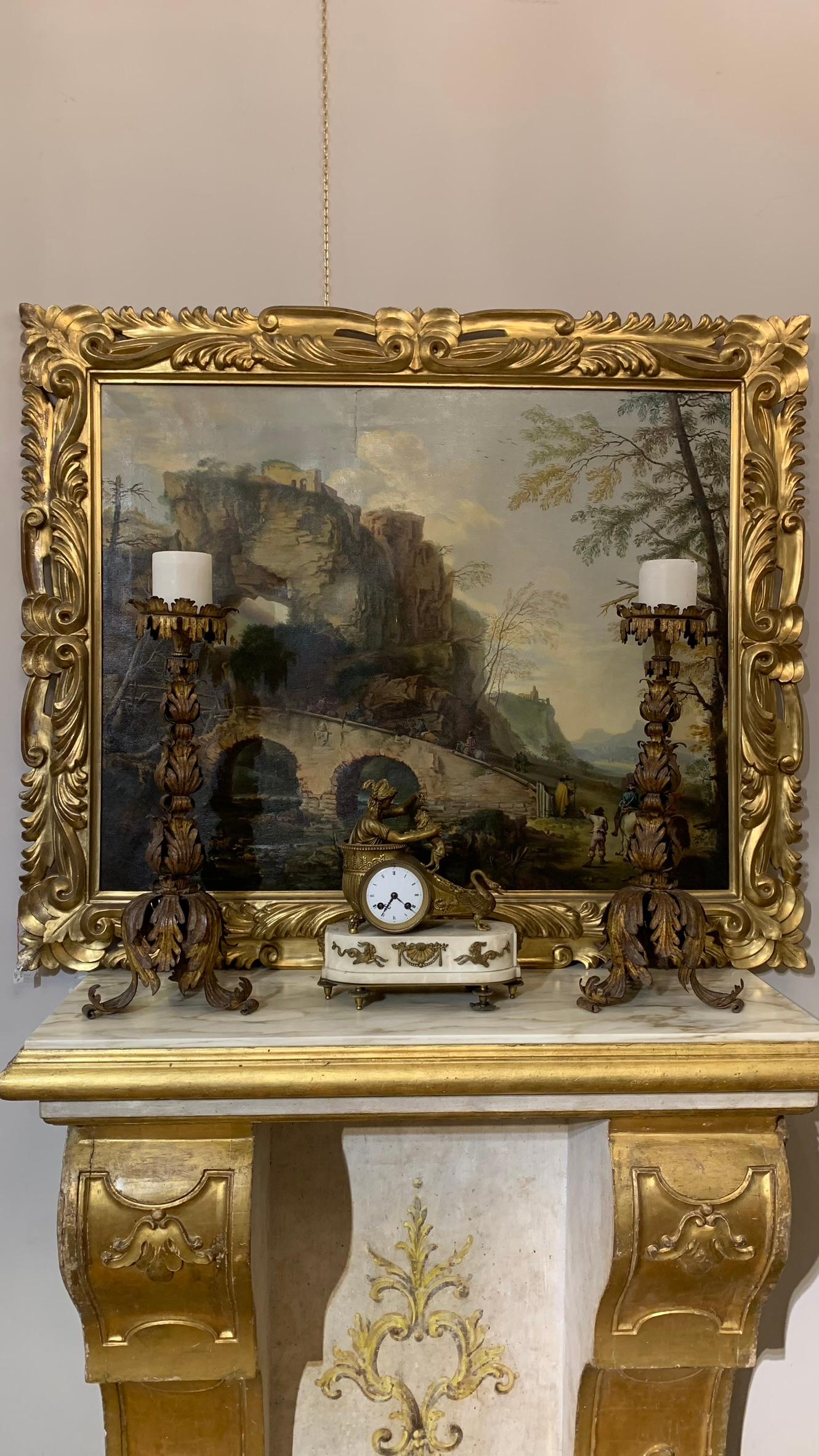 Refined neoclassical clock in gilded bronze and marble base. The body consists of a classical depiction with a gilded bronze chariot and a swan's head, inside which sits a draped girl playing with a dog. The marble base is trapezoidal, on the sides