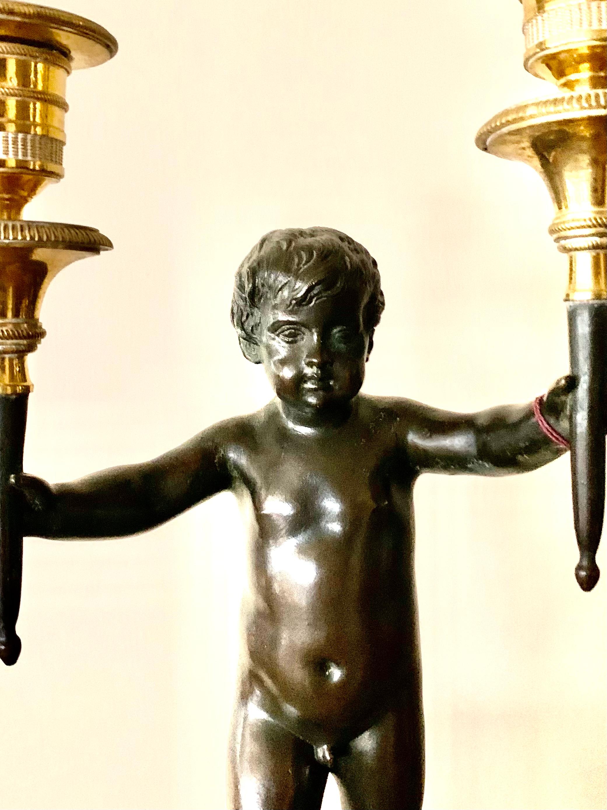 European 18th Century Neoclassical Dore and Patinated Bronze Two Light Putti Candelabra For Sale