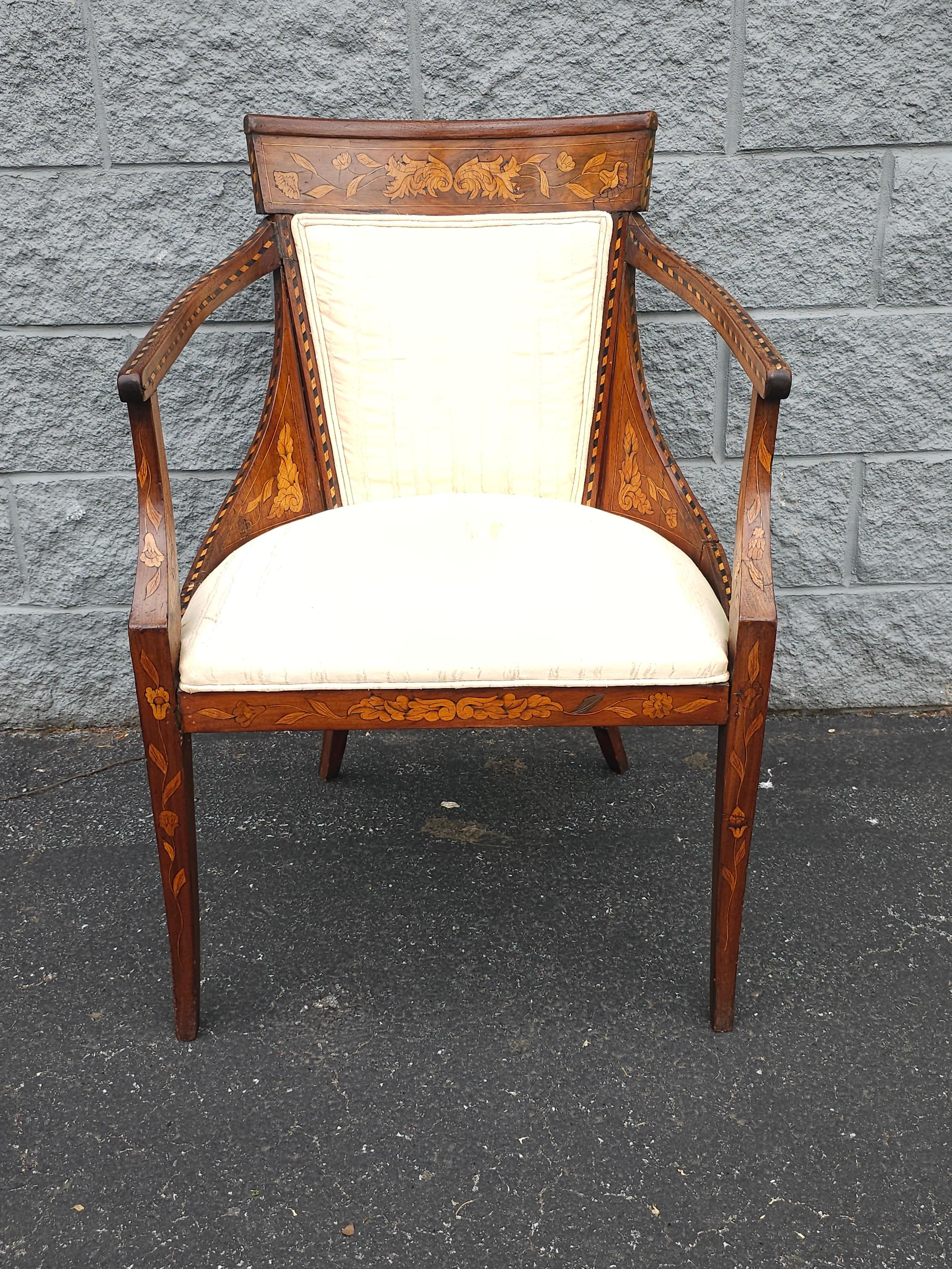An 18th Century Neoclassical Dutch Marquetry Satinwood inlays And Upholstered Armchair. Frame in good antique condition. Need new upholstery. We can have it Reupholstered to suit your desired decor.  Measures 24.75