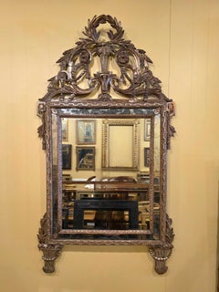 Specchio neoclassico del XVIII secolo in legno intagliato in oro e argento dorato Italia