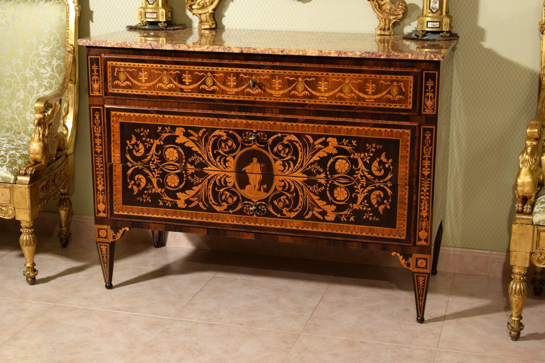 18th century, neoclassical Italian inlay wood chest of drawers

This refined neoclassical chest of drawers was built around the end of the 18th century in the Lombard area (north of Italy - Milan). The cabinet has two large drawers and a smaller