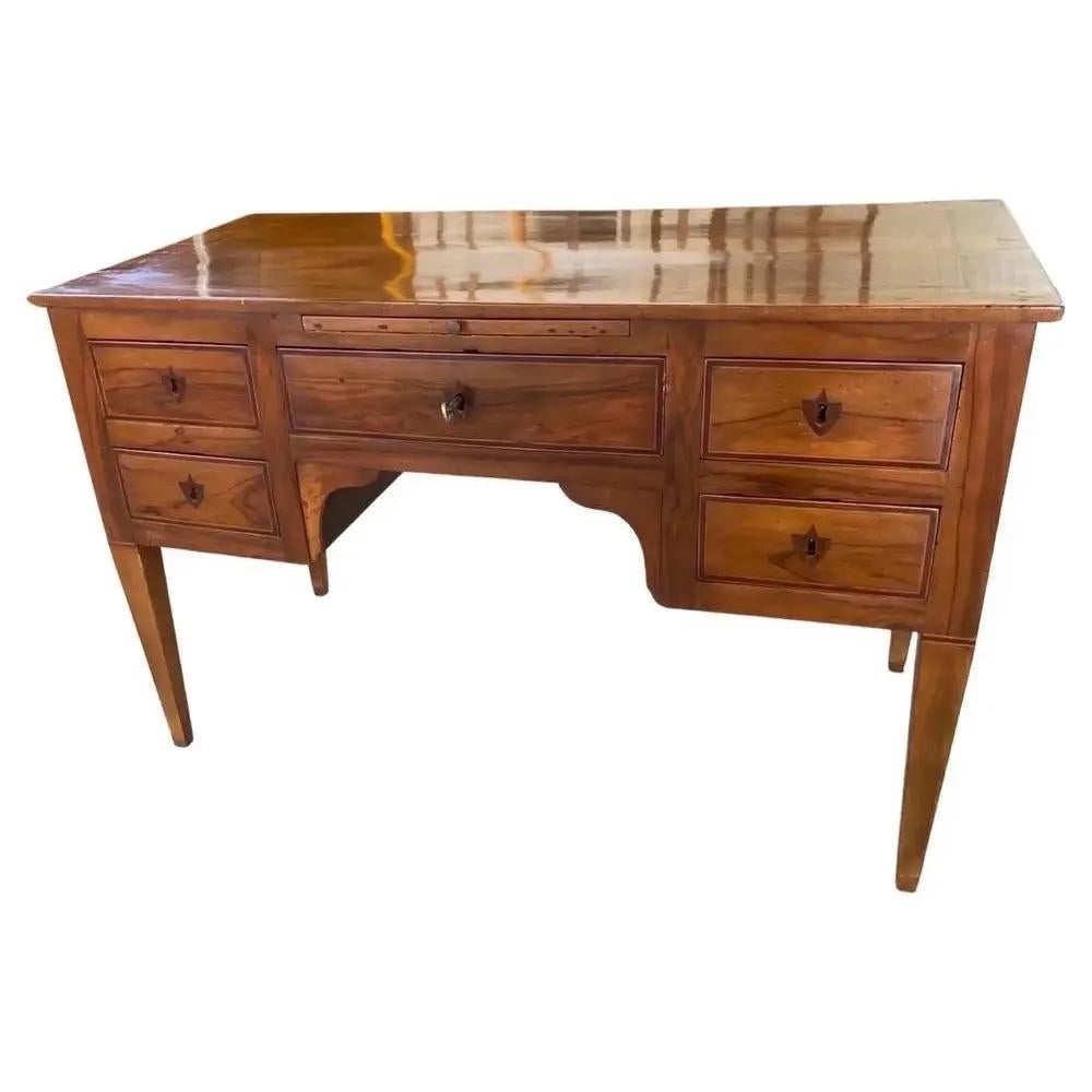 Stunning writing desk hand-made in Italy in the mid 1700s using walnut. This really is the mother of all Italian scrivanie (writing desks): its lines, details and overall look make it a perfect piece for whoever is looking for a classical piece that