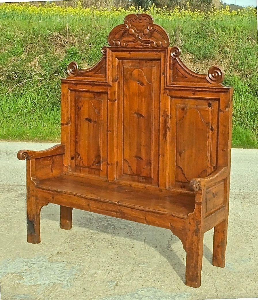 A beautifully carved and well preserved antique high back bench from the province of Huesca (region of Aragon) in the Spanish Pyrenees. 

Produced in honey pine, this impressive mid to late 18th century Charles III Neoclassical bench measures 60