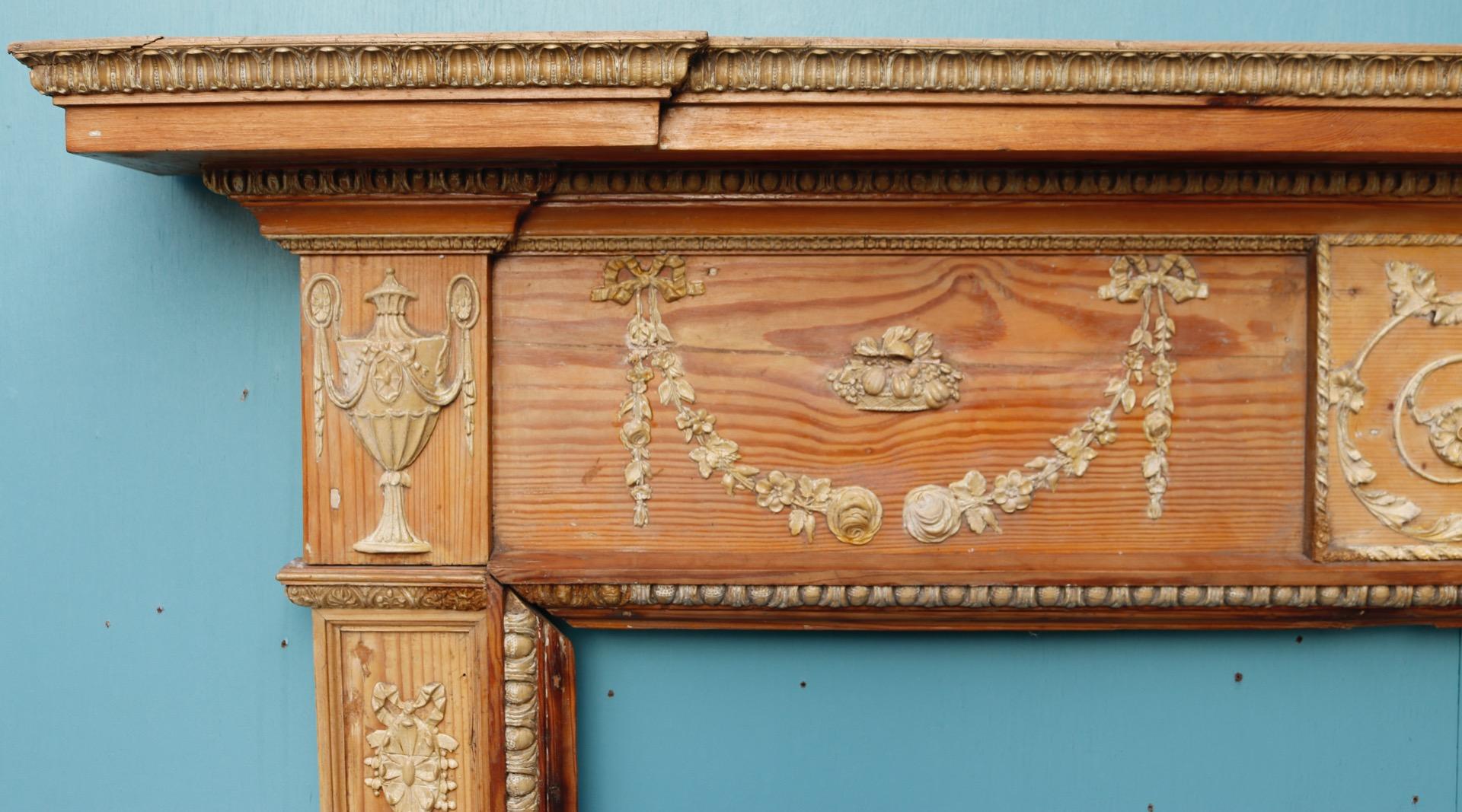 A Georgian style pine fire surround with composition decoration. The central frieze depicts a human form, possibly the Greek God Apollo.
Additional dimensions 
Opening height 117.5 cm
Opening width 132 cm
Width between outsides of the foot