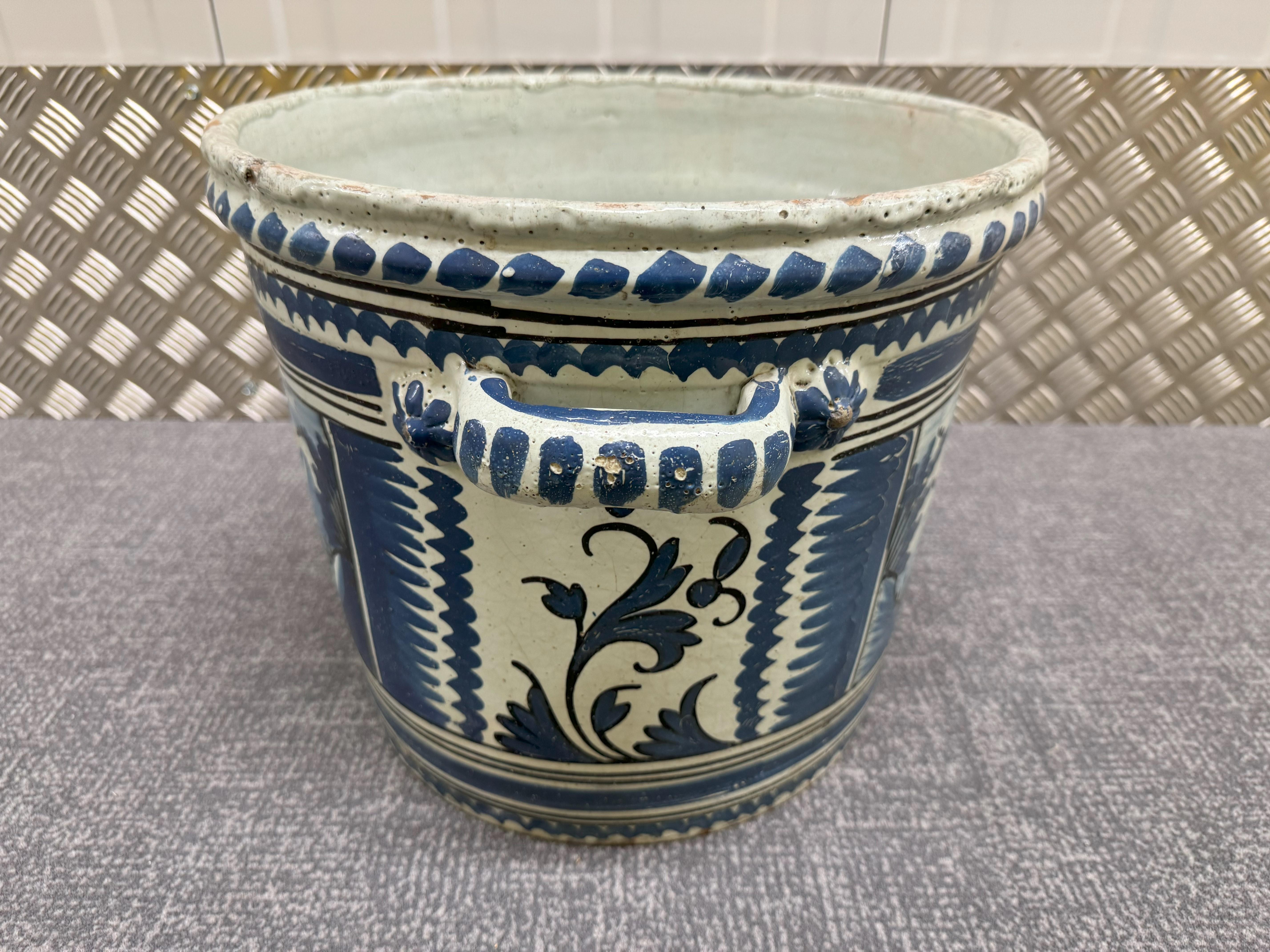 Nevers Faience 'Pot a Oranger' adorned with painted Asian house scene and a flowered decoration in shades of blue (camaieu bleu). Circa 1750 tin-glazed planter, unusually large size and with two handles.

