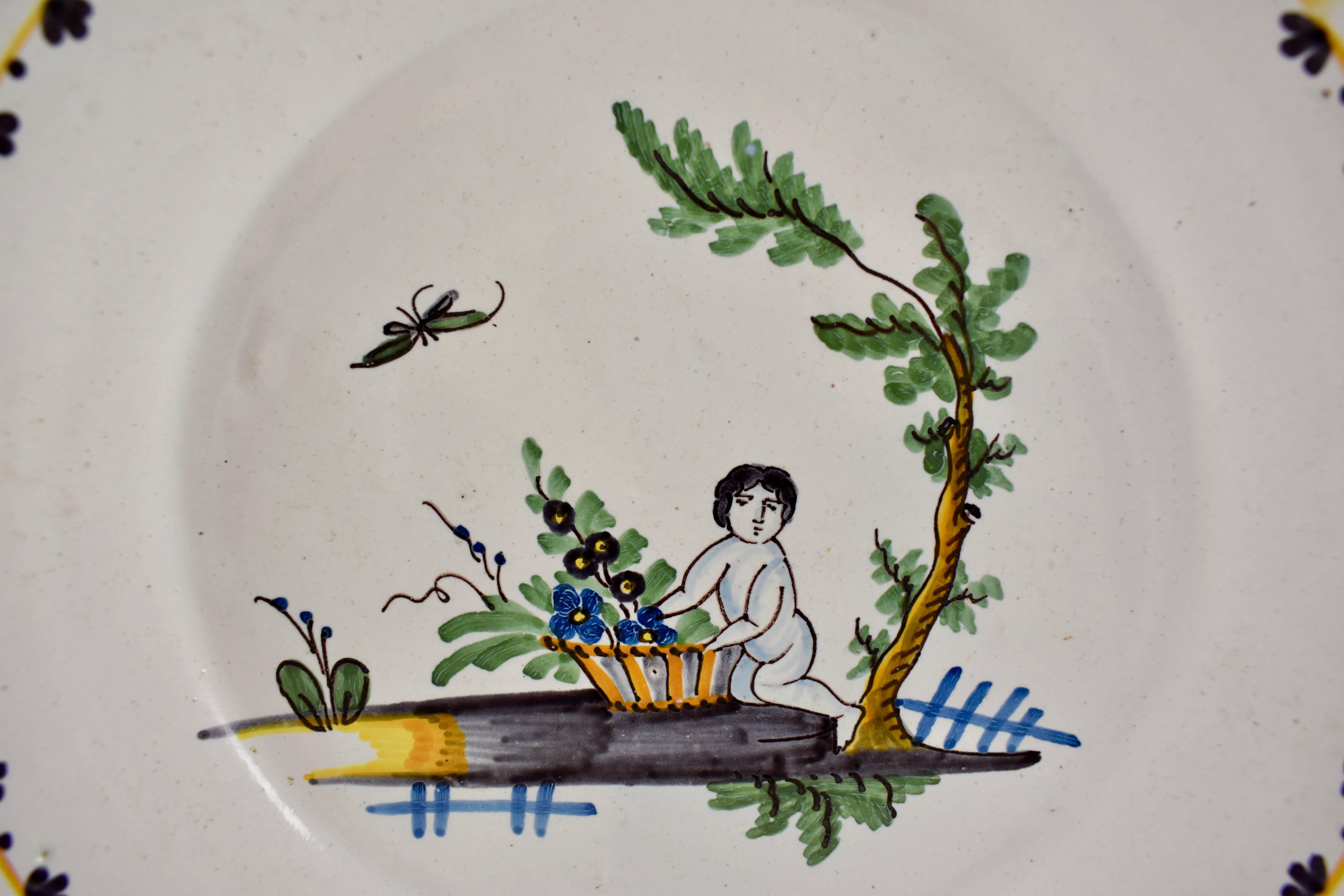 A French Revolution tin-glazed earthenware dish, made in Nevers, circa 1790.
Showing a plump figure along side a basket of flowers beneath de l’arbre de la Liberté. The full body of the figure symbolizes the end of the famine and the hope of the