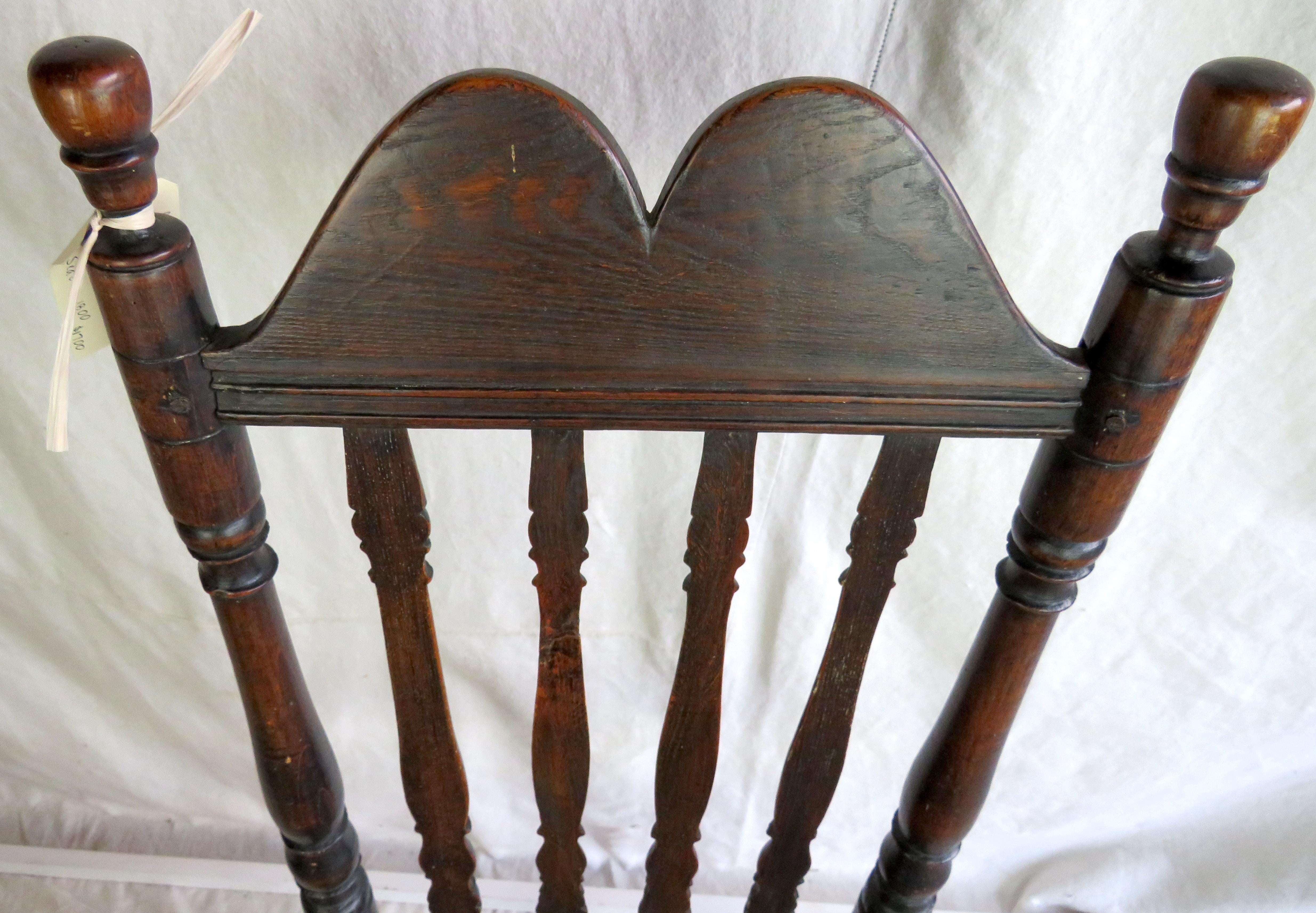 18th century New England Bannister back side chair. With boldly shaped crest rail, turned stiles topped with finials, lightly turned legs supported by turned double stretchers on three sides and a single stretcher across the back. Hand woven