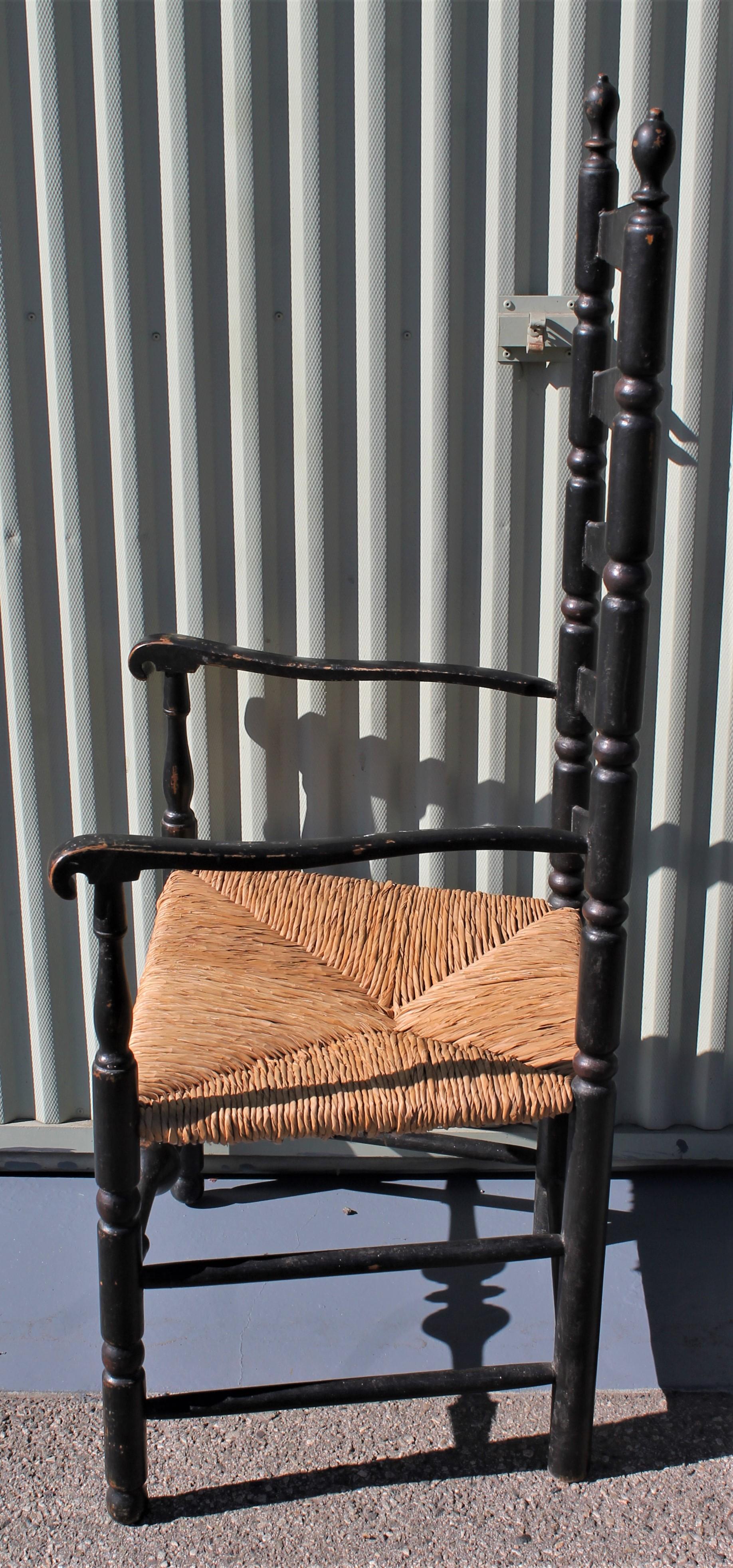 This original black painted 18th century ladder back chair has the original rush painted chair. The chair is in very good condition.