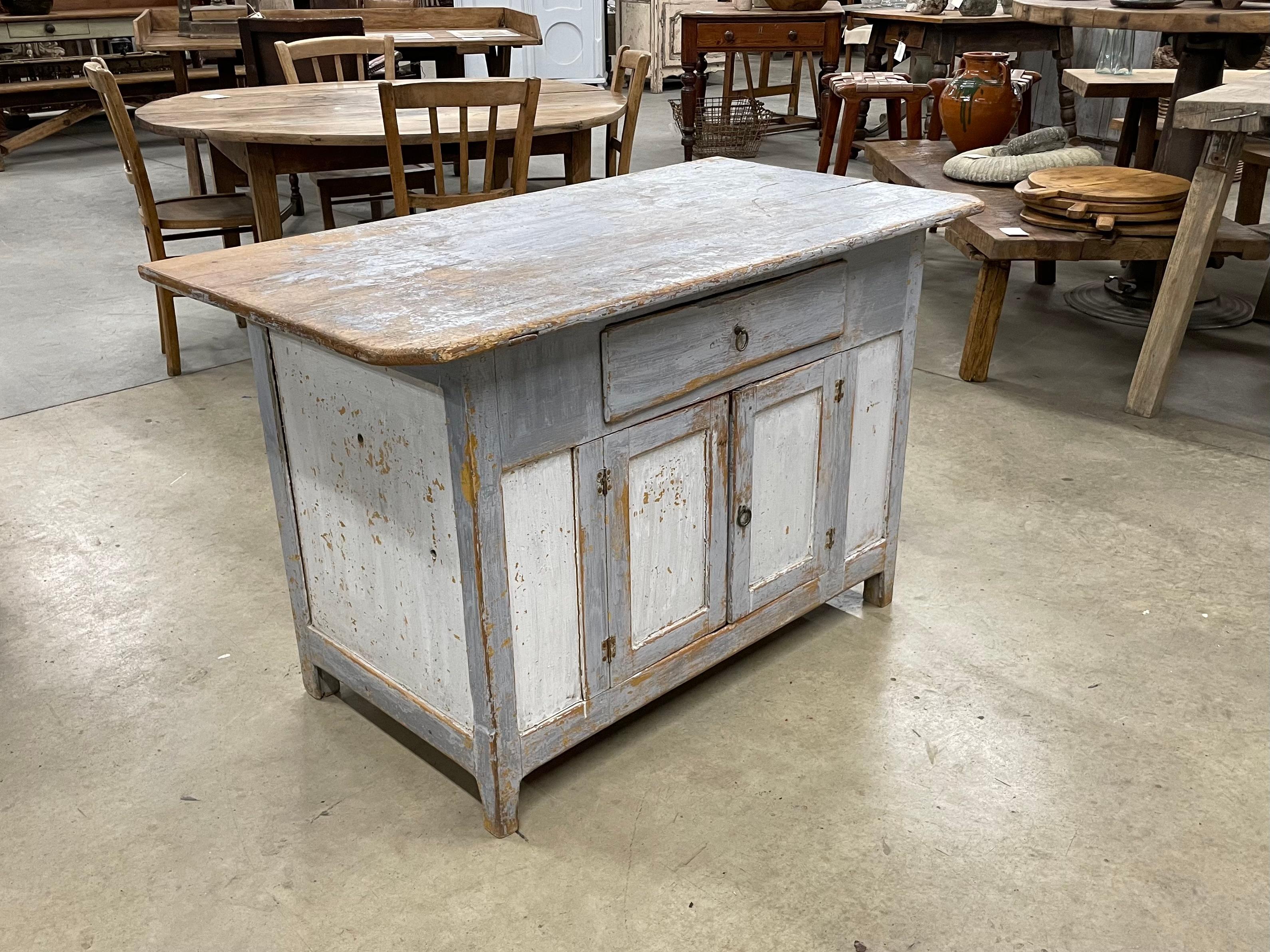 Smaller size Gustavian cupboard from Northern Sweden. This 2 door over one drawer unit has its original hardware and original pale blue and pale grey paint that has distressed beautifully over the years. 

This simplistic design is a perfect