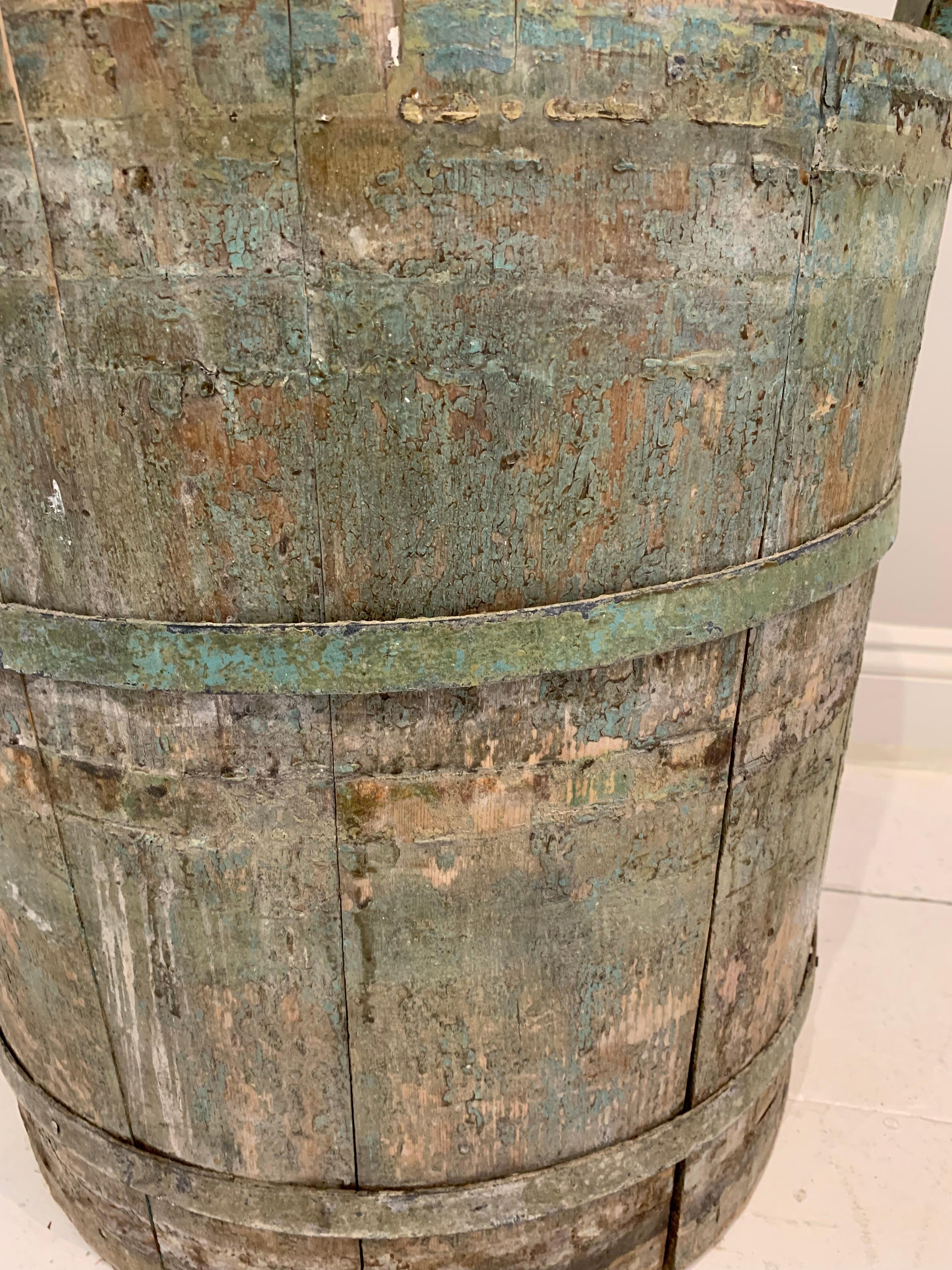An 18th century Northern Sweden rustic painted decorative handled barrel retaining its wonderful original green colour with contrasting natural unpainted wood inside. A beautiful piece perfect as a decorative piece on its own or with a large