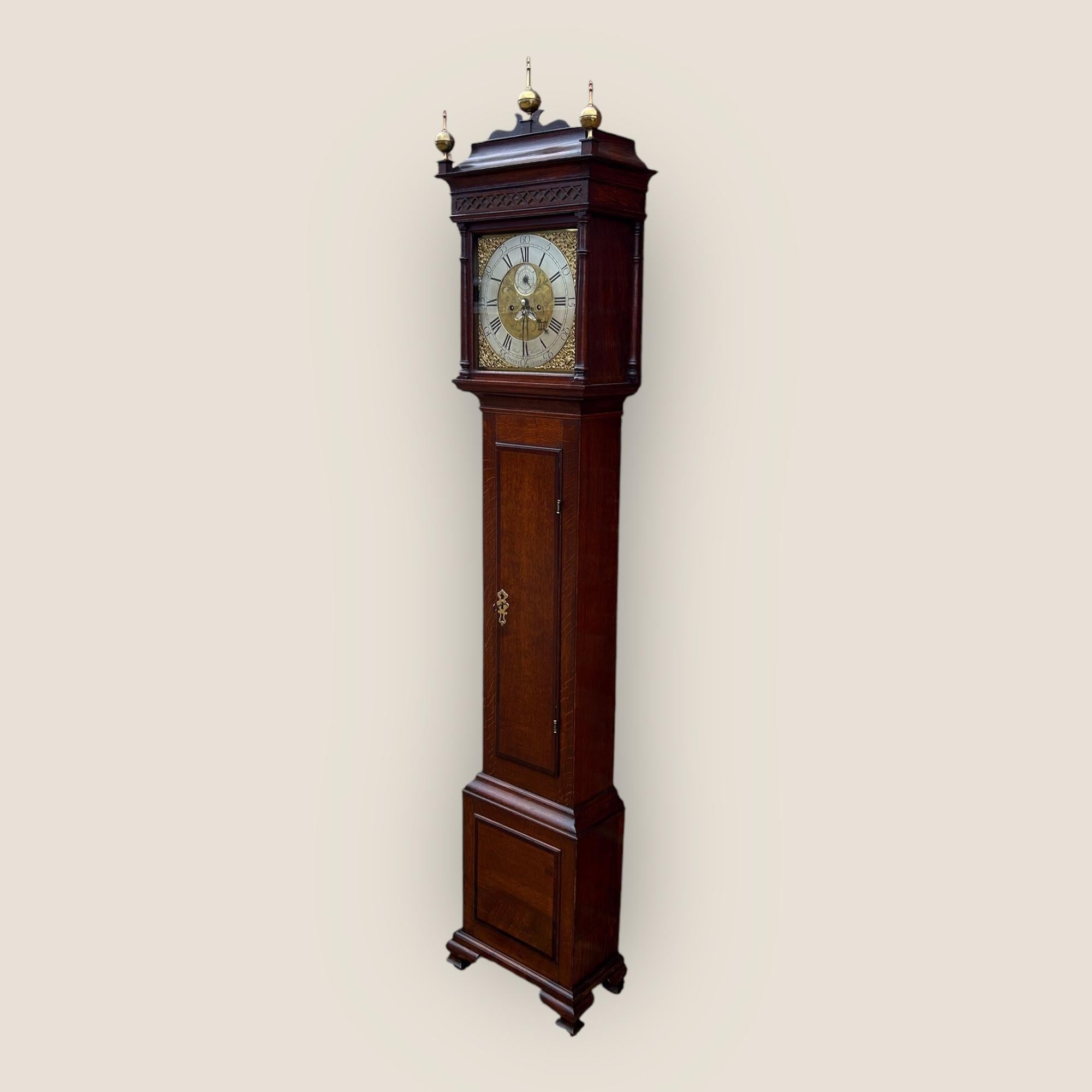 Here we have a beautiful working 18th Century, circa 1770-1790, Oak & Mahogany Crossbanded Grandfather Clock/ long case clock of slender proportions by Richard Houton Of Oversly Green with an 8 day movement. This clock has an etched brass and silver