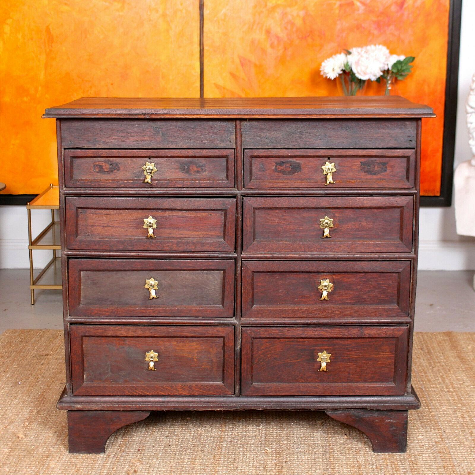 An impressive 18th century oak chest of drawers.
Constructed from solid oak boasting an impressive well figured wild grain and aged rich patina. Heavy for the size owing to the thick cut of oak.
Fitted eight drawers with dovetailed jointing, oak