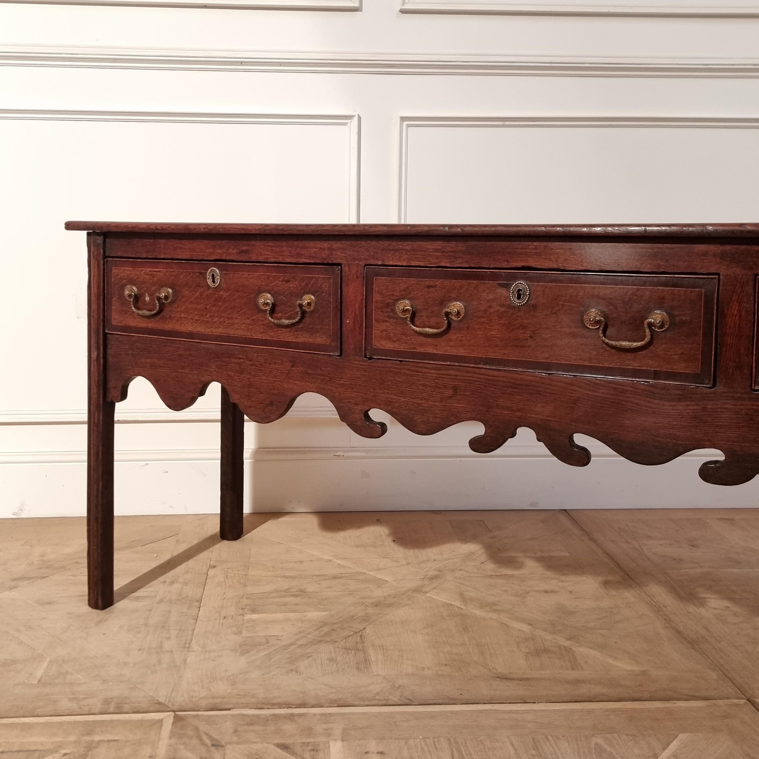 Late 18th C English 3 drawer oak cross-banded dresser base. 1790.

This piece has a rack should you want a full dresser.

Reference: 7721

Dimensions
71 inches (180 cms) Wide
21 inches (53 cms) Deep
30 inches (76 cms) High.