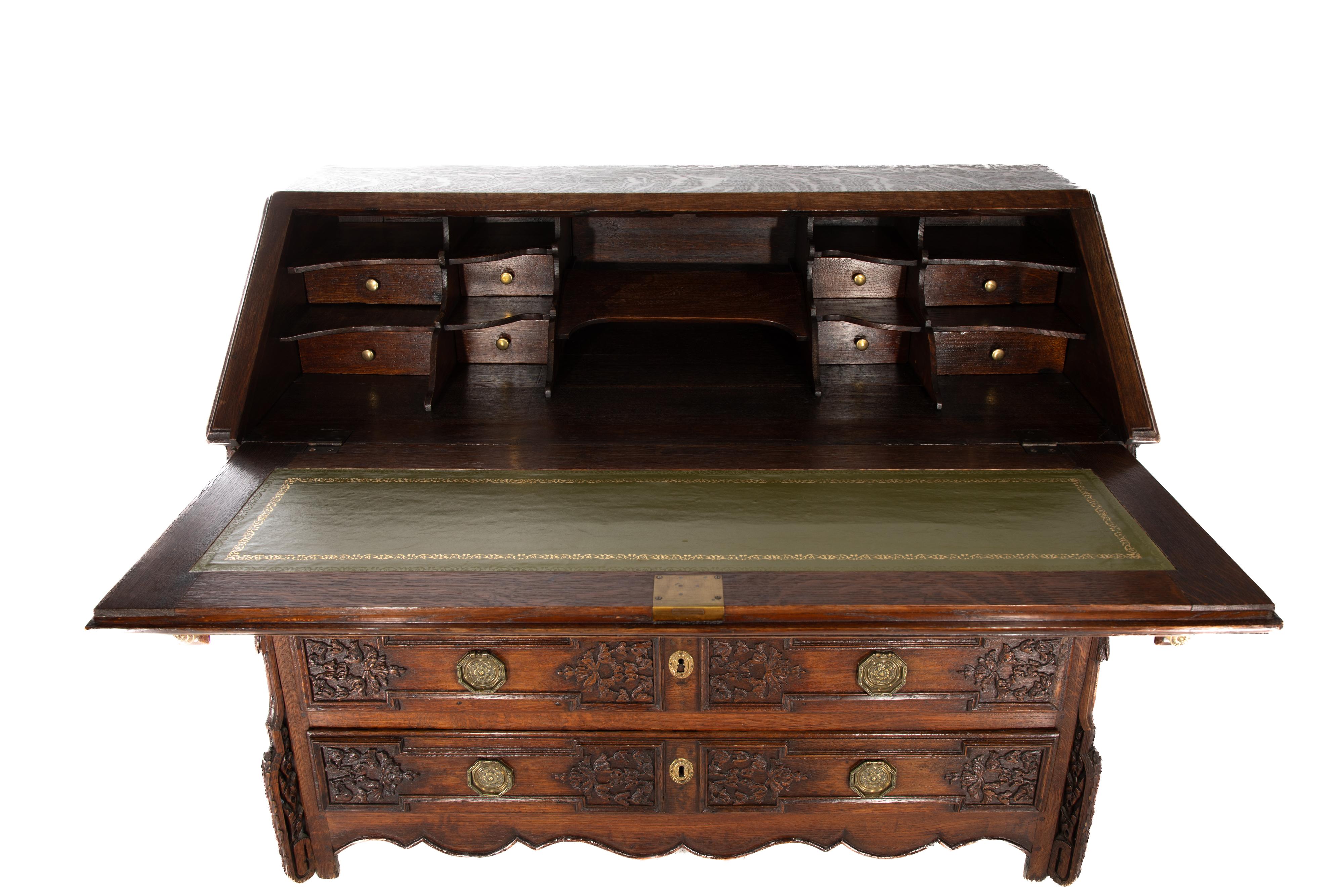 French oak drop front secretarie with green leather writing surface.
Circa 1780
