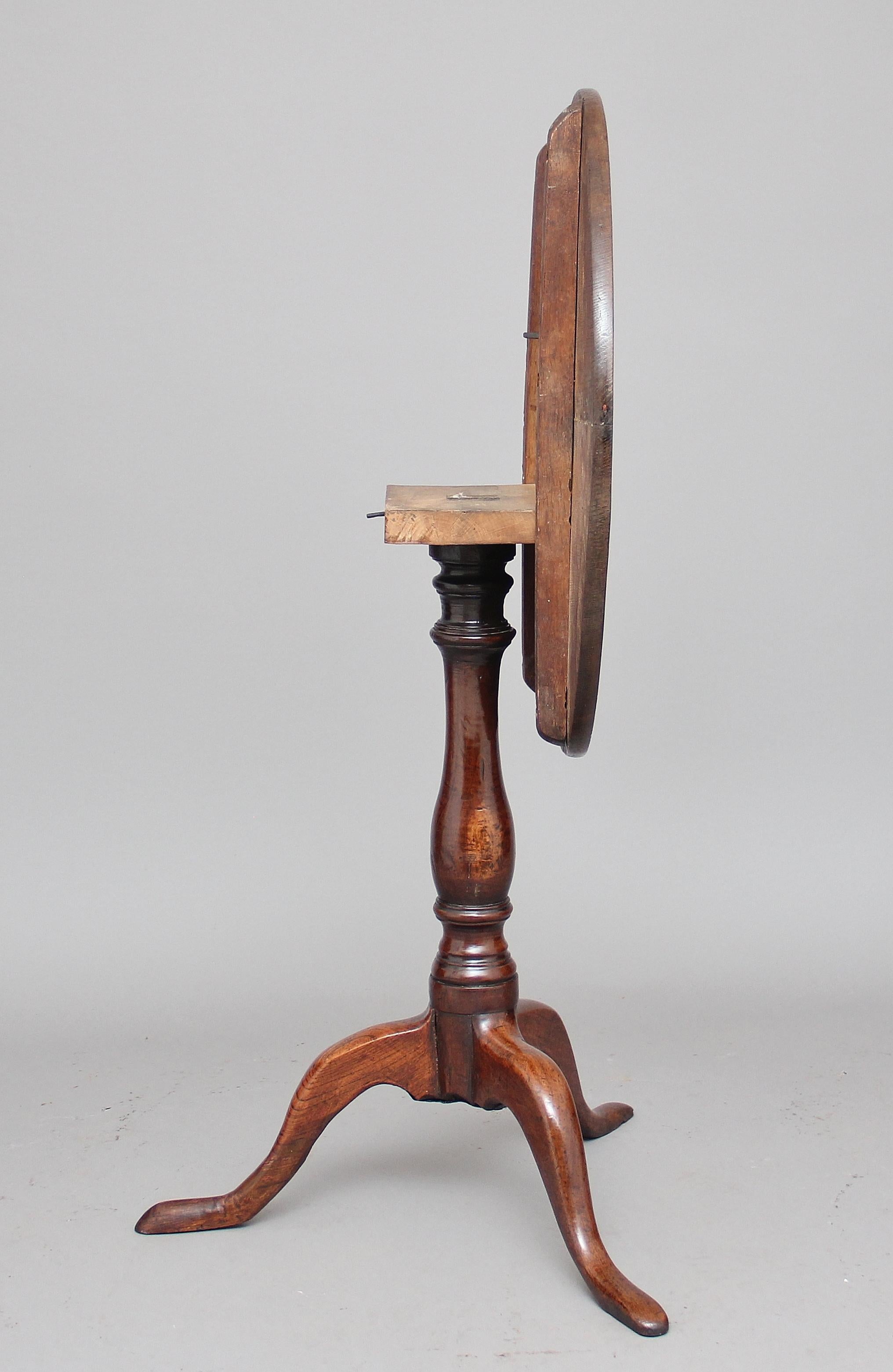 18th century oak tripod table, the circular tilt top supported on a lovely turned column with three slender cabriole legs. Lovely patina, circa 1780.