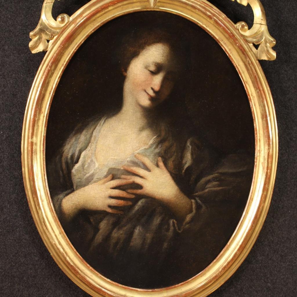 Antique French painting from the late 18th century. Framework oil on canvas depicting a female portrait of a religious character of good pictorial quality. 19th century oval frame with non-Coeval cymatium (added during the 20th century) of beautiful