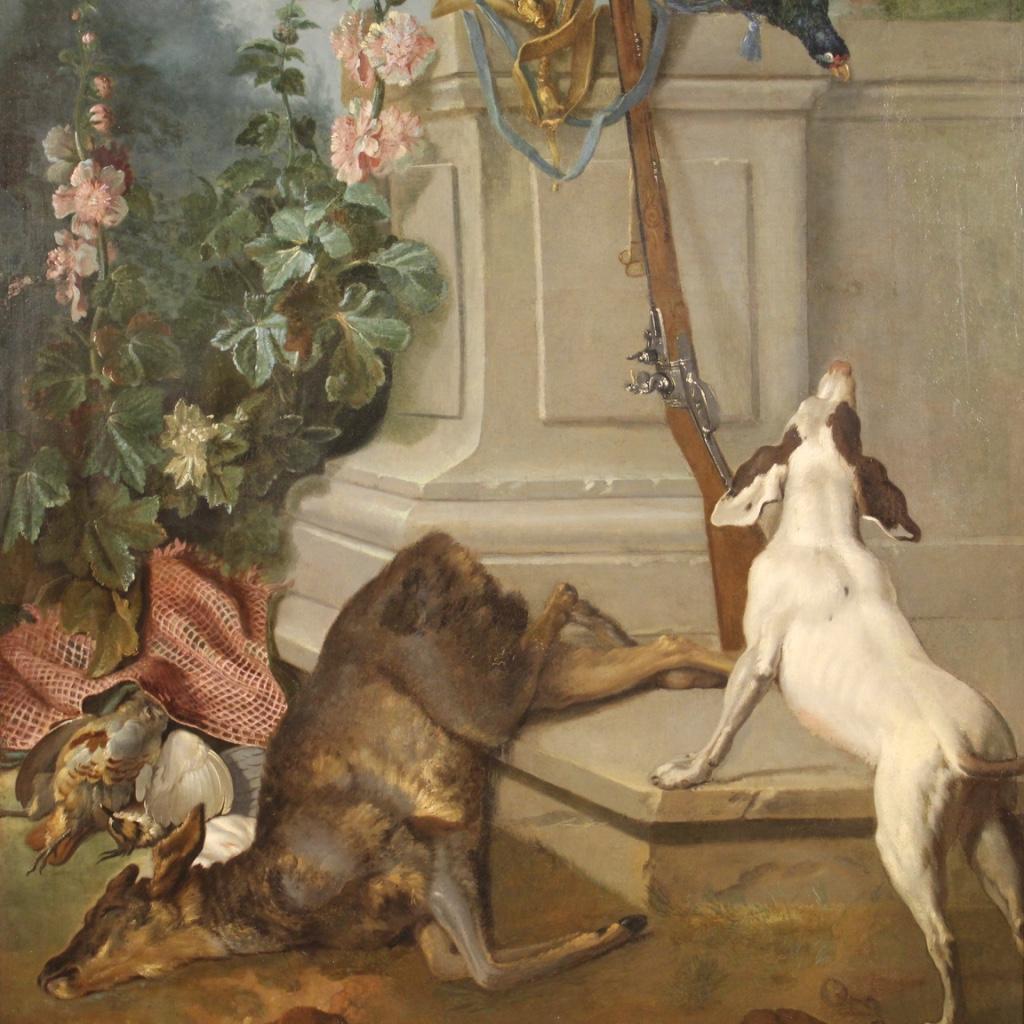 Antique French painting from the 18th century. Framework oil on canvas depicting a particular still life with hunting scene of excellent pictorial quality. Framework of exceptional size and impact rich in decorative elements, animals and floral