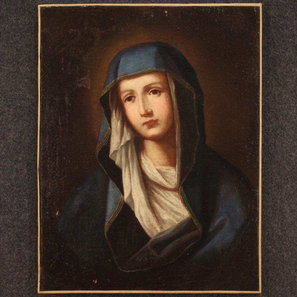 Antique Italian painting from the 18th century. Work oil on canvas depicting a religious subject Madonna of good pictorial quality. Painting of excellent proportion, for antique dealers, interior decorators and collectors of ancient sacred art. Work