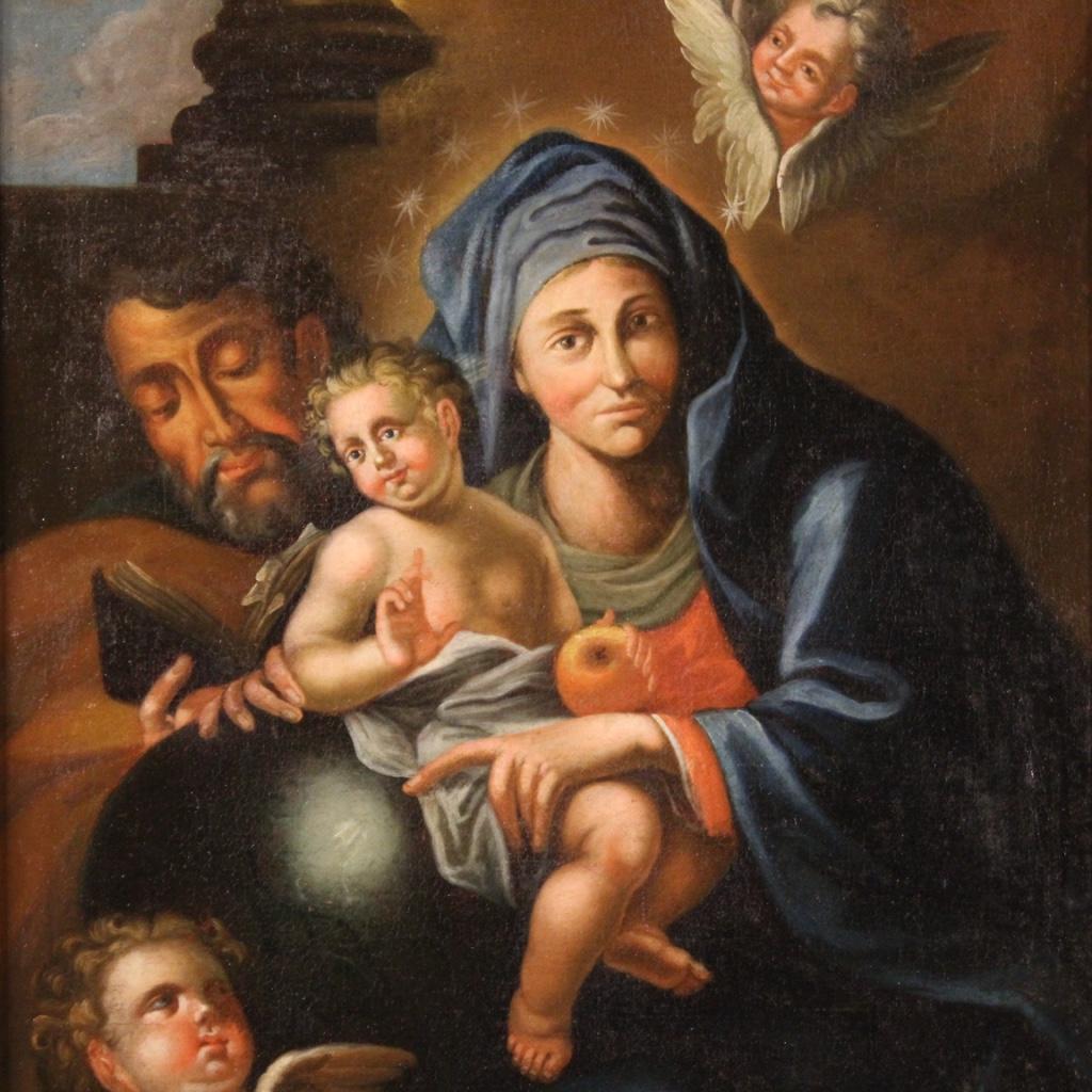Antique Italian painting from 18th century. Oil on canvas framework depicting religious subject Holy family with little angels of good pictorial quality. Beautifully sized and pleasantly decor framework for antique dealers, interior decorators and