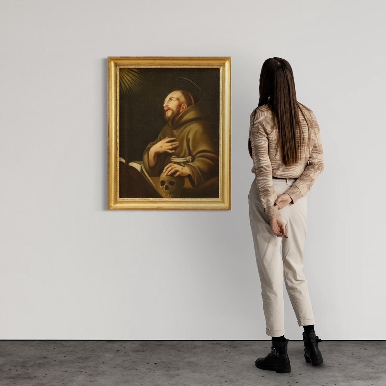 Antique French painting from the 18th century. Framework oil on canvas depicting a religious subject Saint Francis of good pictorial quality. Non-contemporary frame in wood and plaster, carved and gilded, with some signs of aging and a small lack of