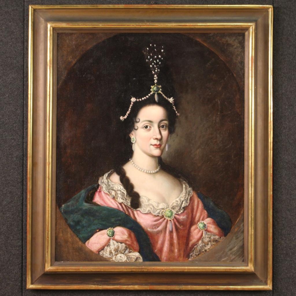 Antique Italian portrait of the first half of the 18th century. Oval-shaped oil artwork on rectangular canvas, depicting a charming lady, noblewoman with an elegant dress of excellent pictorial quality. Painting of exquisite workmanship and