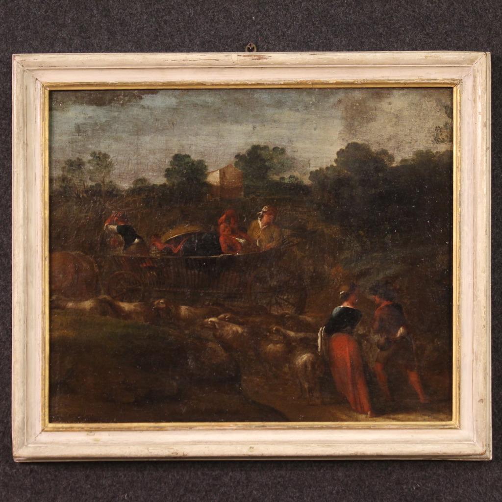 Antique Italian painting from the 18th century. Artwork oil on canvas depicting a bucolic landscape, pastoral scene with chariot of good pictorial quality. Small painting adorned with a lacquered and gilded wooden frame of the 20th century with