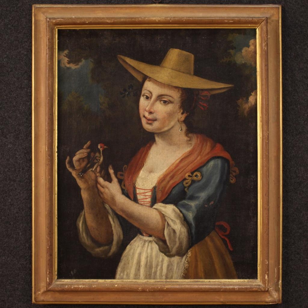 Antique Italian painting from 18th century. Framework oil on canvas depicting a portrait of a girl with a goldfinch of good pictorial quality. Framework of good size and pleasant furnishings, for antique dealers, interior decorators and collectors