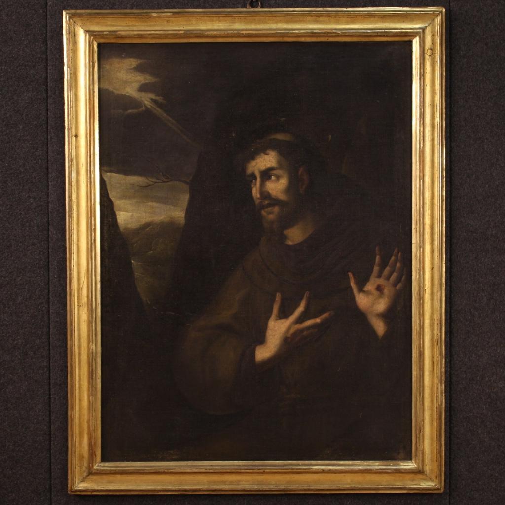 Antique Italian painting from 18th century. Painting oil on canvas depicting the religious subject of Saint Francis of excellent pictorial quality. Wood and plaster frame from the 19th century, carved and gilded, with small drops of color and some