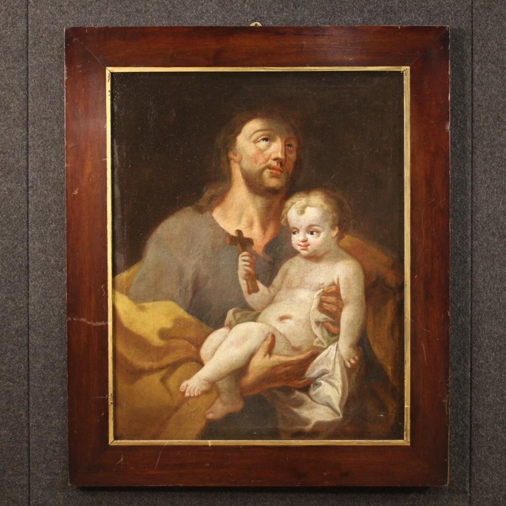 Antique Italian painting from the 18th century. Framework oil on canvas, on the first canvas, depicting a religious subject Saint Joseph with baby Jesus of good pictorial quality. Nice size and pleasantly furnished painting with wooden frame not