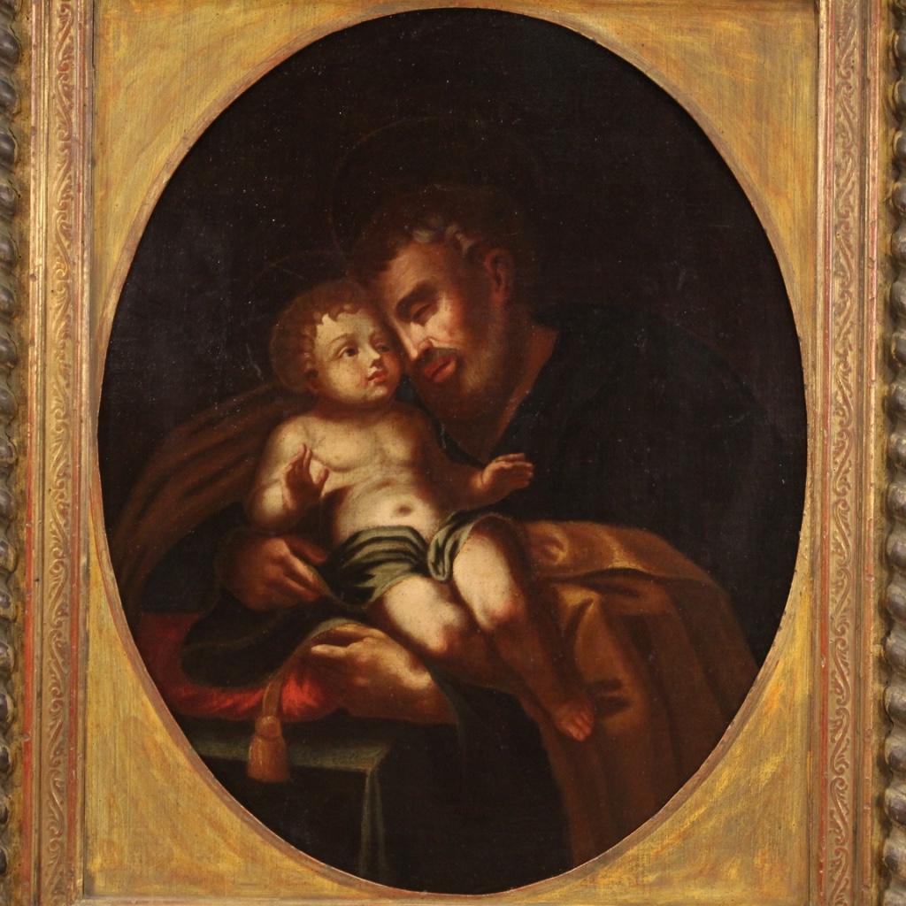 Antique Italian painting from the 18th century. Framework oil on canvas depicting a religious subject Saint Joseph with a child of good pictorial quality. Beautifully sized painting and pleasant impact adorned with a richly sculpted, chiseled,