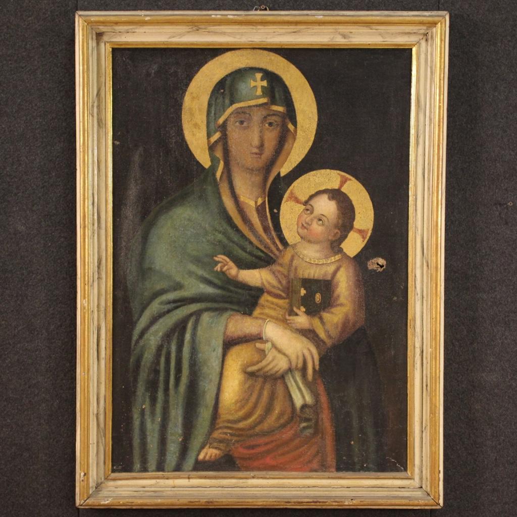 Antique Italian painting from the late 18th century. Virgin with child in Byzantine style of great character and good pictorial hand. Oil painting on canvas with wooden frame not coeval lacquered and gilded, with some signs of aging (see photo).